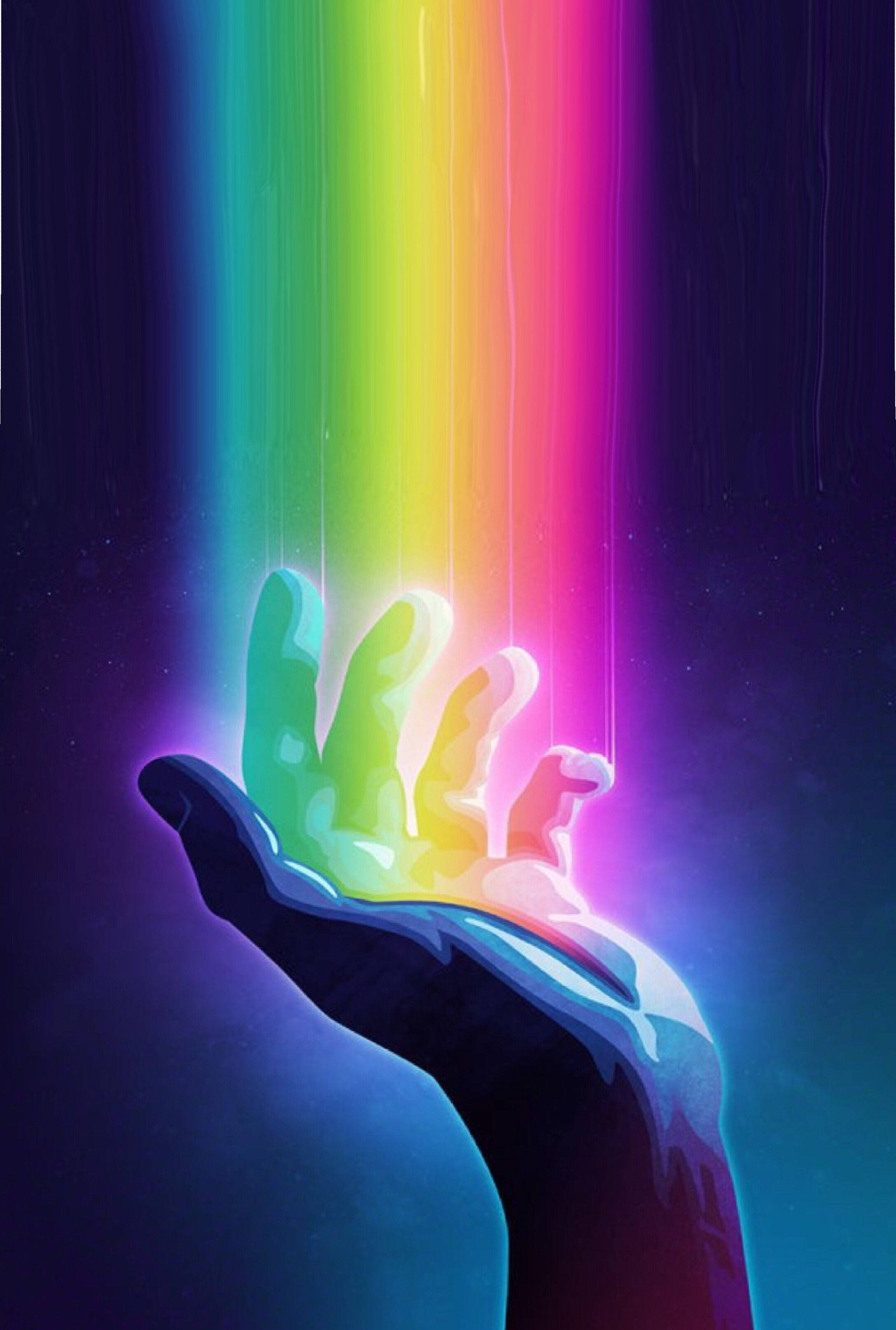 彩虹美學 桌布 壁紙 — 一隻手向上伸出，在黑暗的宇宙背景下捕捉一道充滿活力的彩虹光束。