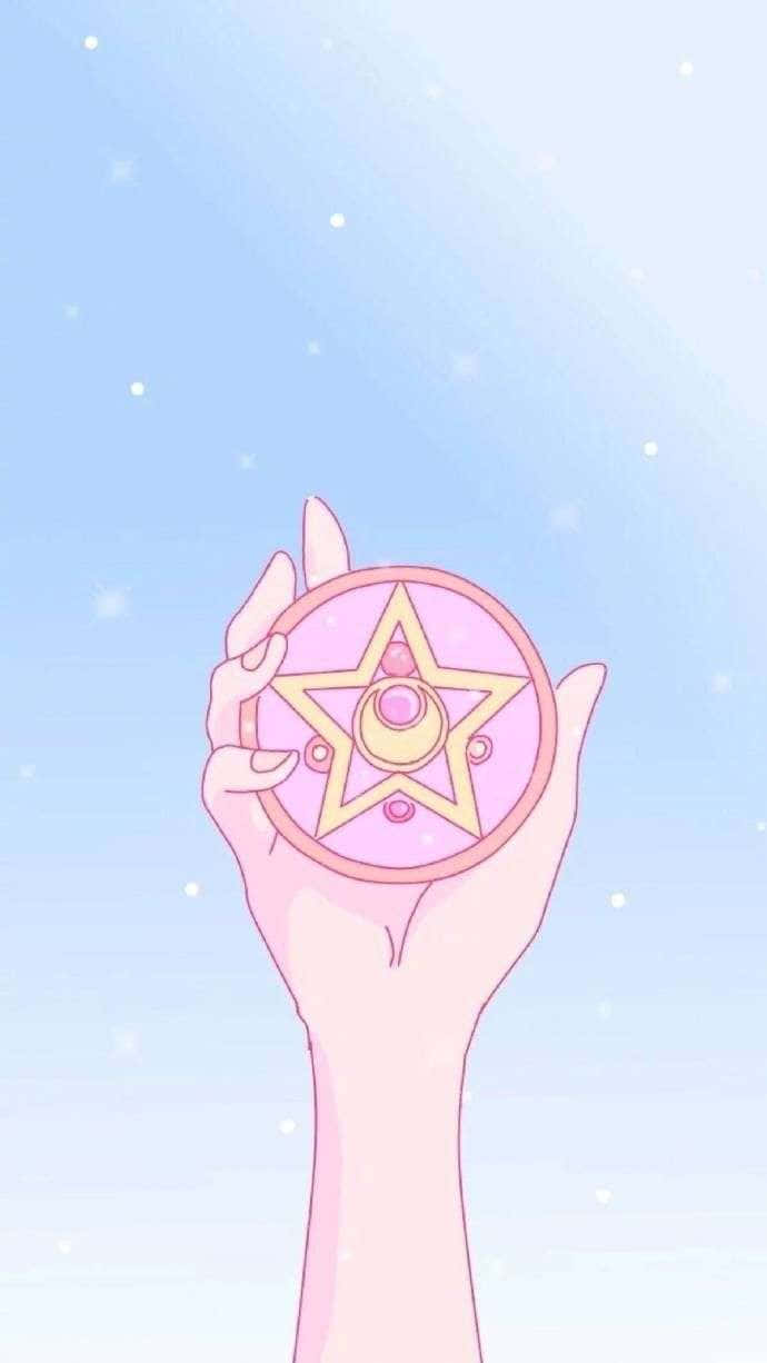 Sailor Moon iPad 桌布 壁紙 — 一隻手拿著粉紅色星形魔法棒，背景是柔和的藍天，點綴著閃爍的星星。