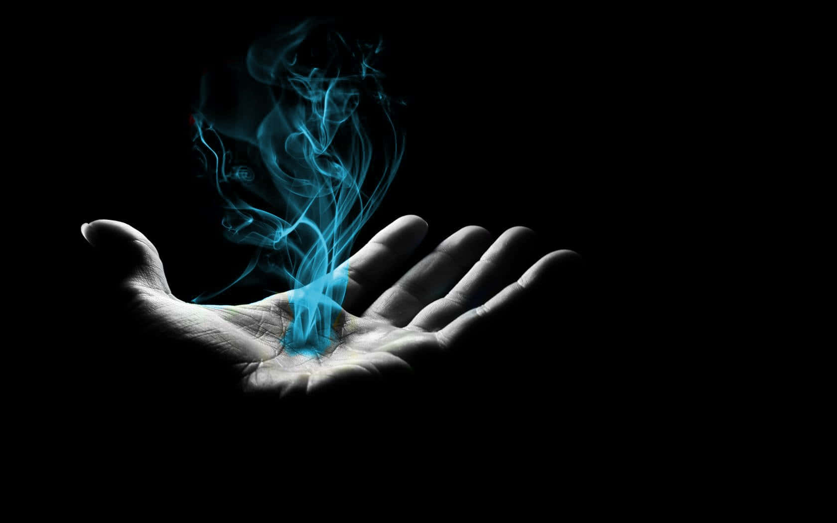 hands 桌布 壁紙 — 一隻手捧著發光的藍色能量，在純黑背景中向上旋轉。