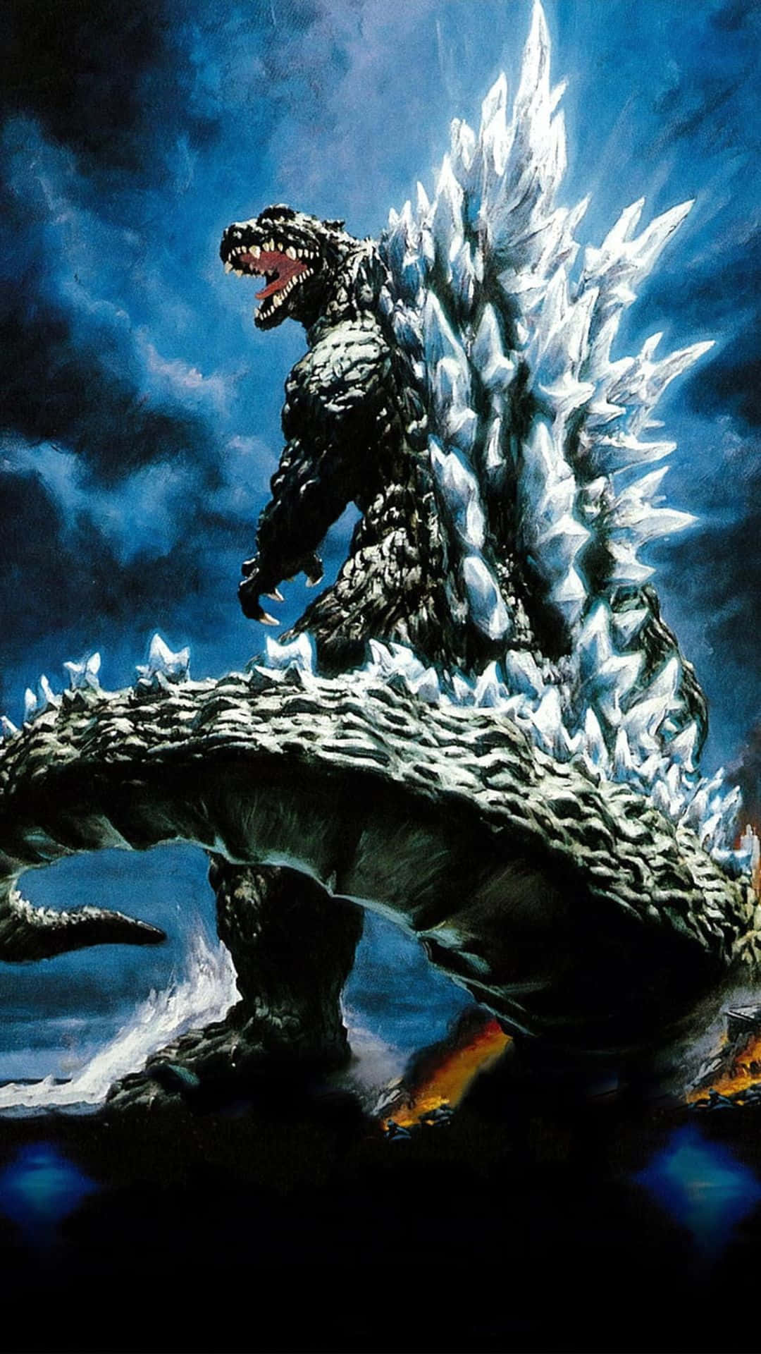 Godzilla 2000 桌布 壁紙 — 一隻擁有鋸齒狀冰刺的巨大哥吉拉在暴風雨藍天下，於熾熱景觀上方咆哮。