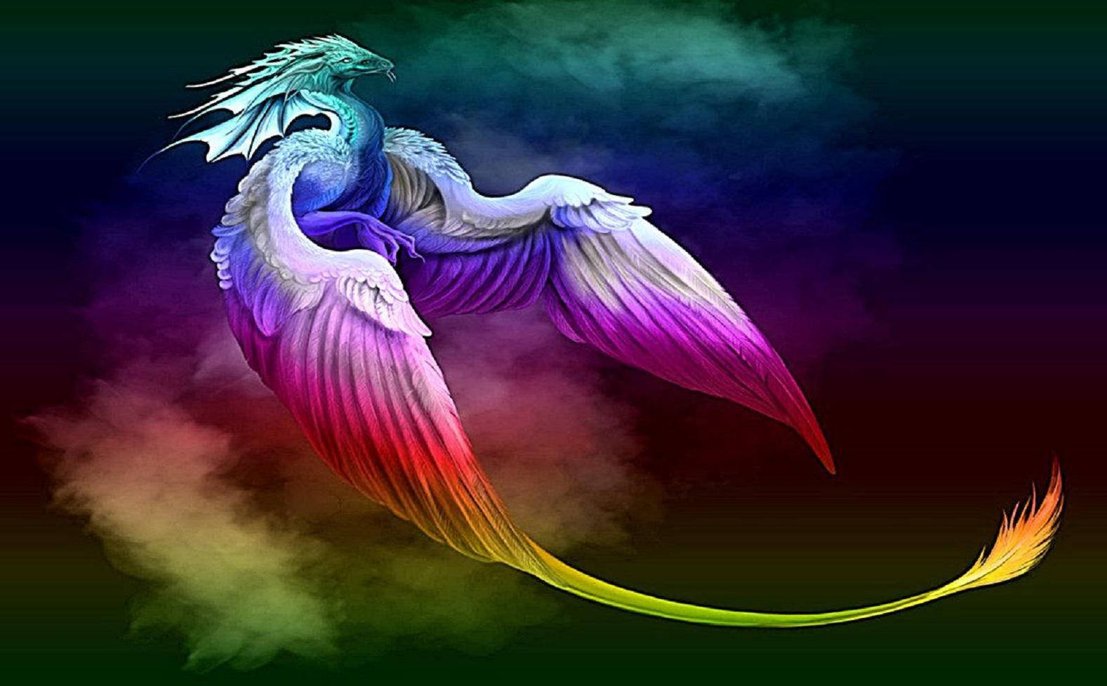 Galaxy Dragon 桌布 壁紙 — 一隻擁有龍頭和鳳凰翅膀的雄偉神話生物，在黑暗的宇宙背景下，滑翔過充滿活力的彩虹色薄霧。