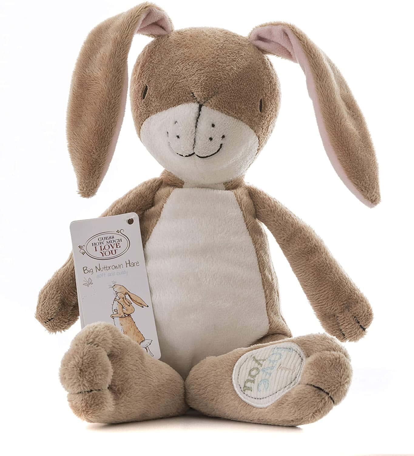 Cuddly 桌布 壁紙 — 一隻柔軟的棕色長耳毛絨兔玩具坐在白色背景前，拿著一個寫著「Guess How Much I Love You」的標籤。