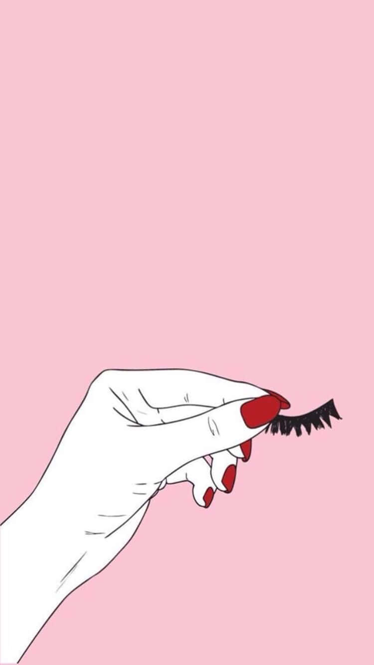 Cute Makeup 桌布 壁紙 — 一隻極簡線條藝術的手，紅色指甲，在柔和的粉紅色背景上輕輕拿著一條黑色假睫毛。