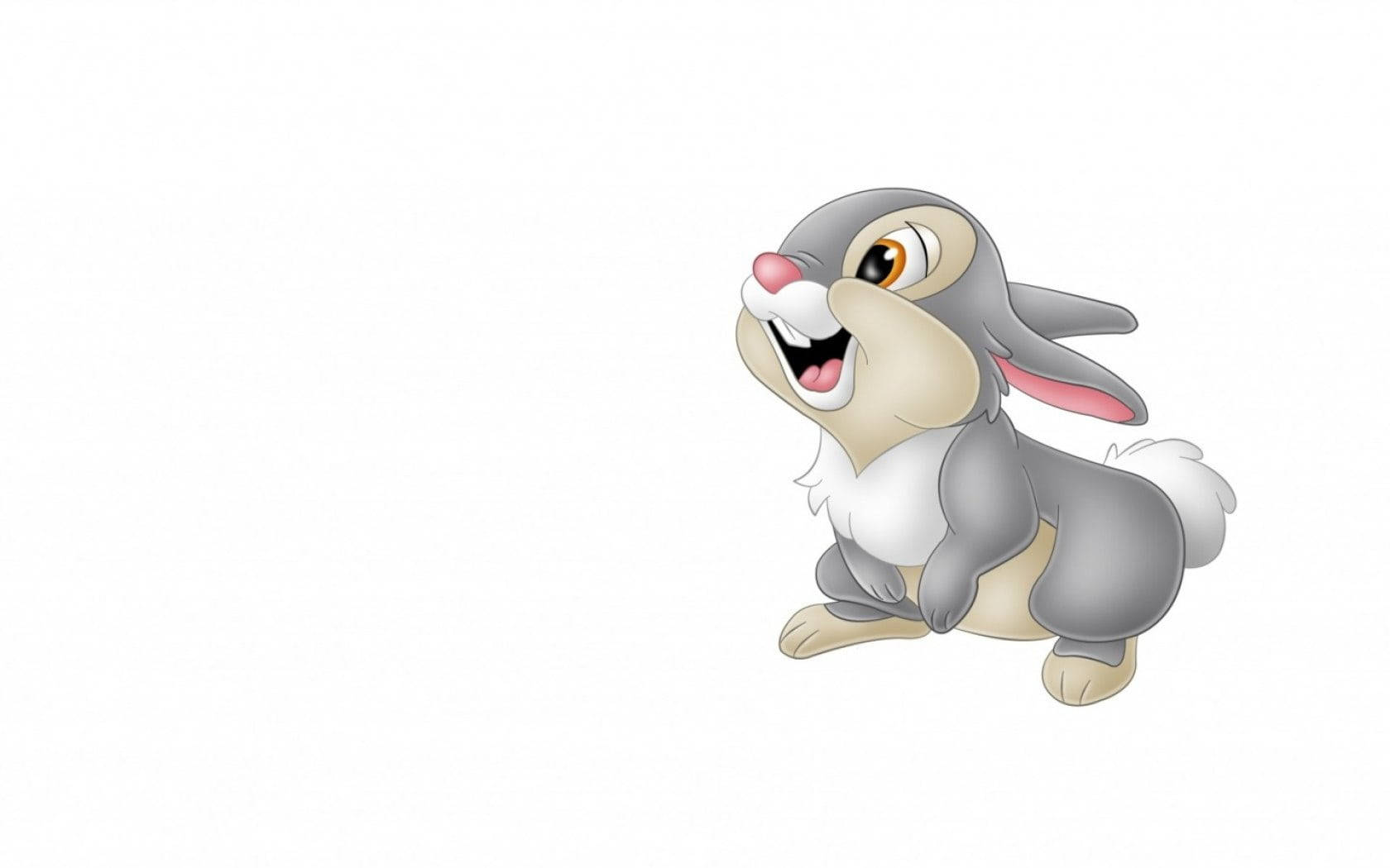 Cute Bunny 桌布 壁紙 — 一隻灰色毛髮、咧嘴大笑的卡通兔子坐在純白背景上。