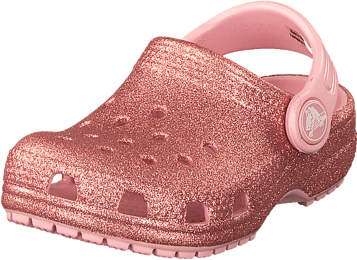 Crocs 桌布 壁紙 — 一隻玫瑰金色閃粉木屐鞋，配有粉紅色帶子和標誌，背景為純綠色。