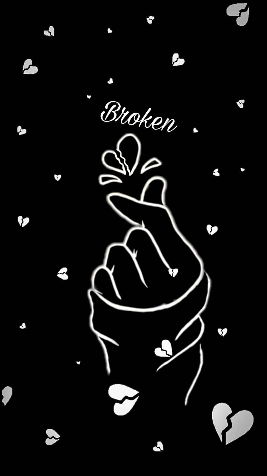 一隻發光的手做出愛心手勢，周圍環繞著破碎的心和「broken」一詞。 — 心形美學 GIF 壁紙