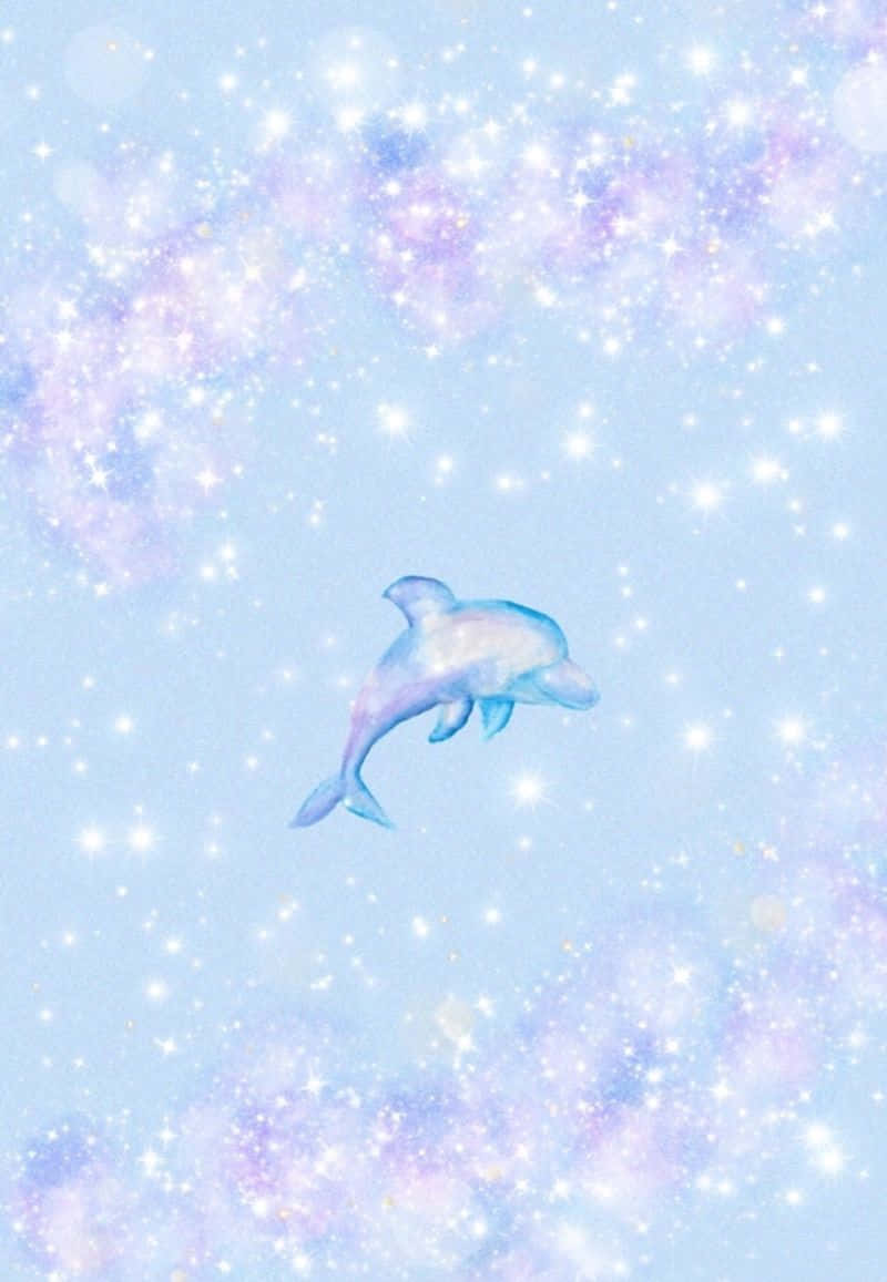 Cute Dolphin 桌布 壁紙 — 一隻發光的藍色海豚跳過佈滿星星的粉彩天空，天空充滿閃爍的宇宙雲。