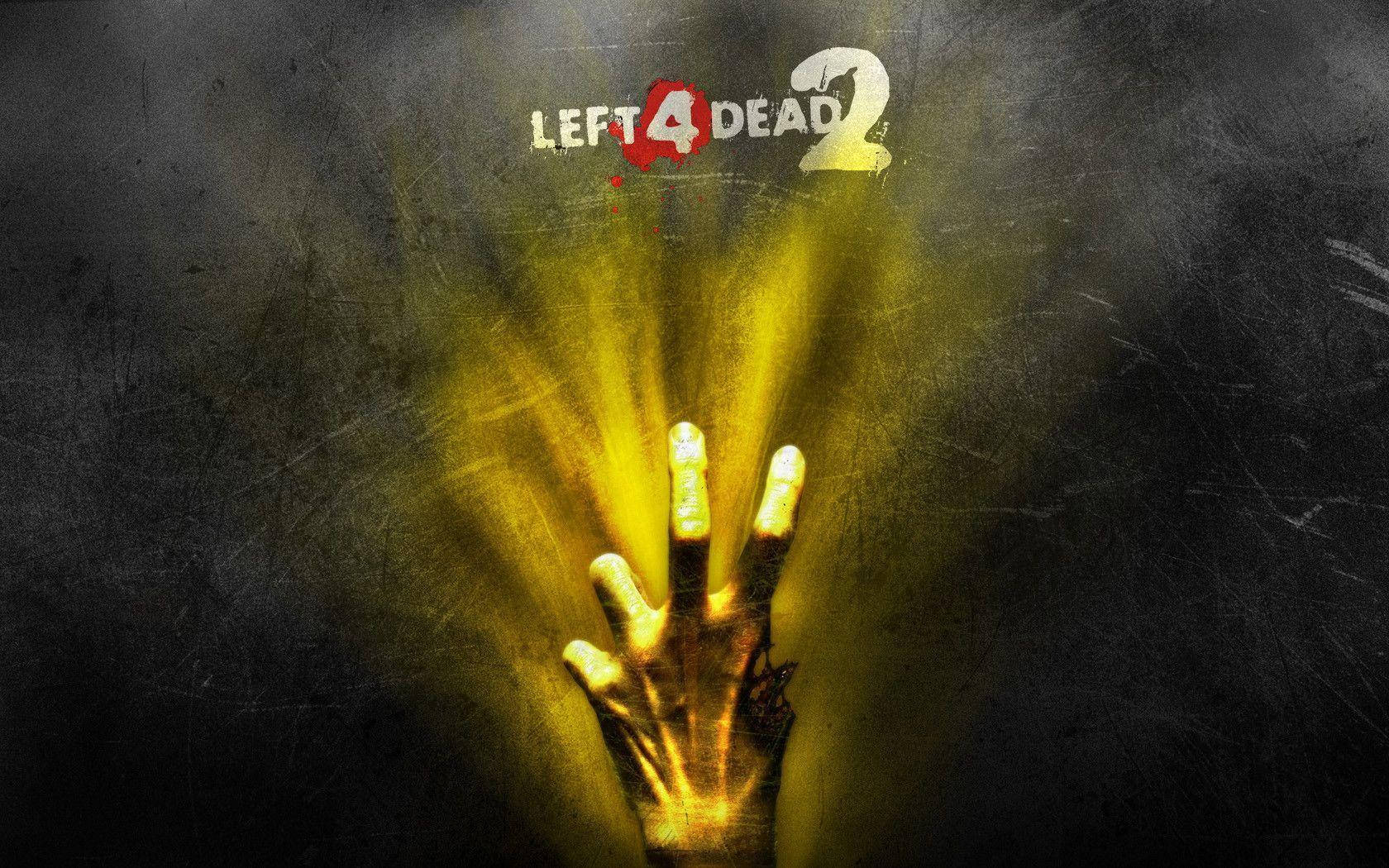 殭屍動圖 桌布 壁紙 — 一隻發光的黃色手從黑暗中向上伸出，上方有「Left 4 Dead 2」標誌。