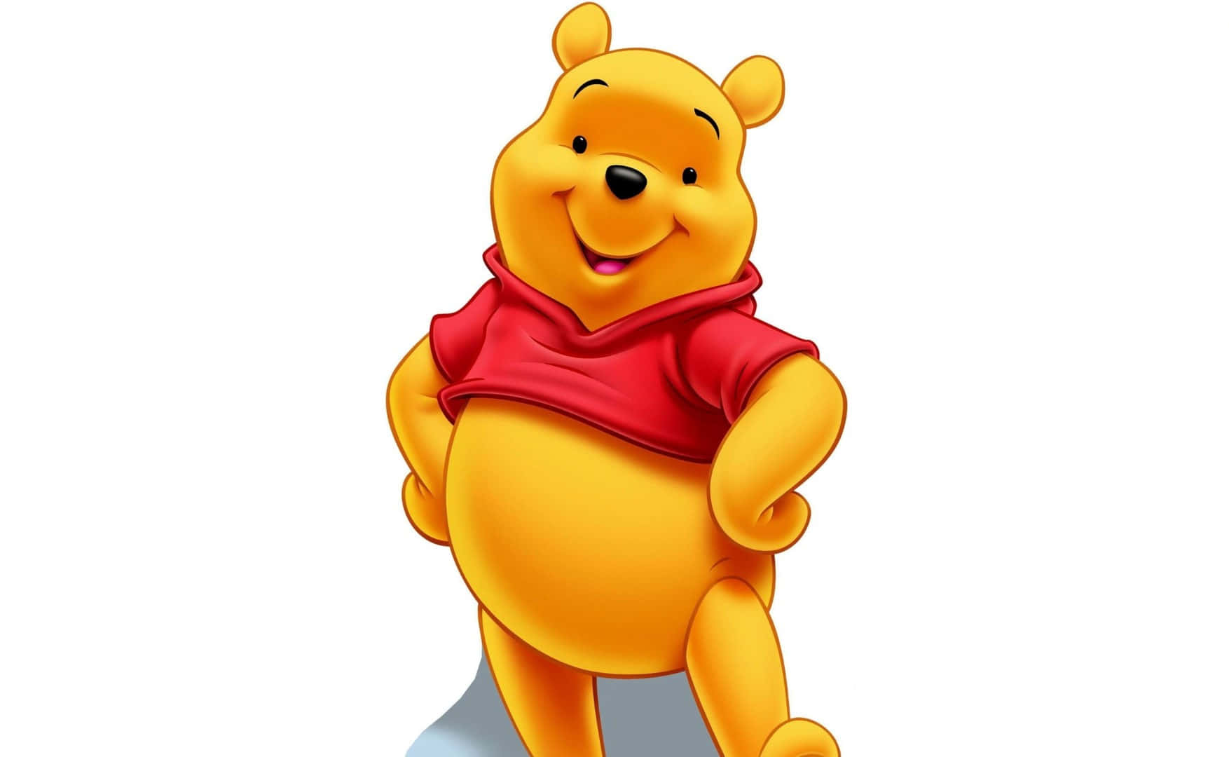 Winnie The Pooh Laptop 桌布 壁紙 — 一隻穿著紅色襯衫的快樂黃色卡通熊在純白色背景上燦爛地微笑。