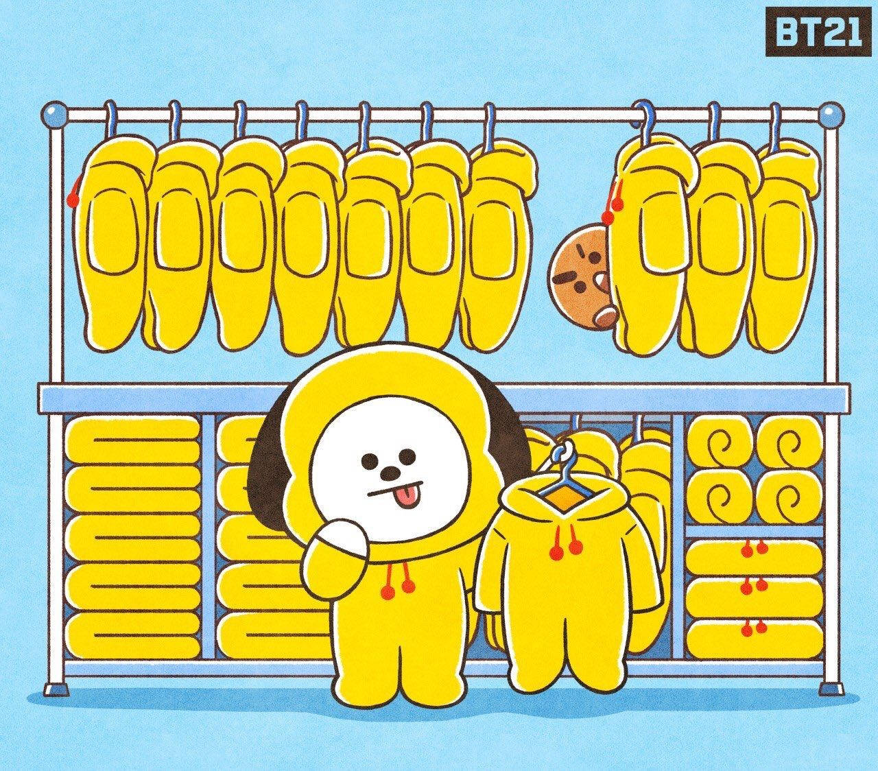 Chimmy 桌布 壁紙 — 一隻穿著黃色連帽衫的可愛卡通狗自豪地站在充滿黃色服裝的服裝店裡。