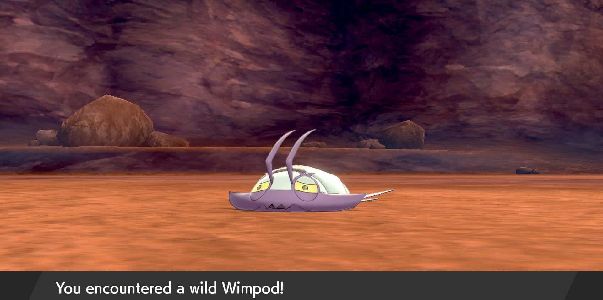 一隻紫色Wimpod寶可夢在洞穴下的沙漠中爬行。 — 任天堂Switch 動圖 壁紙