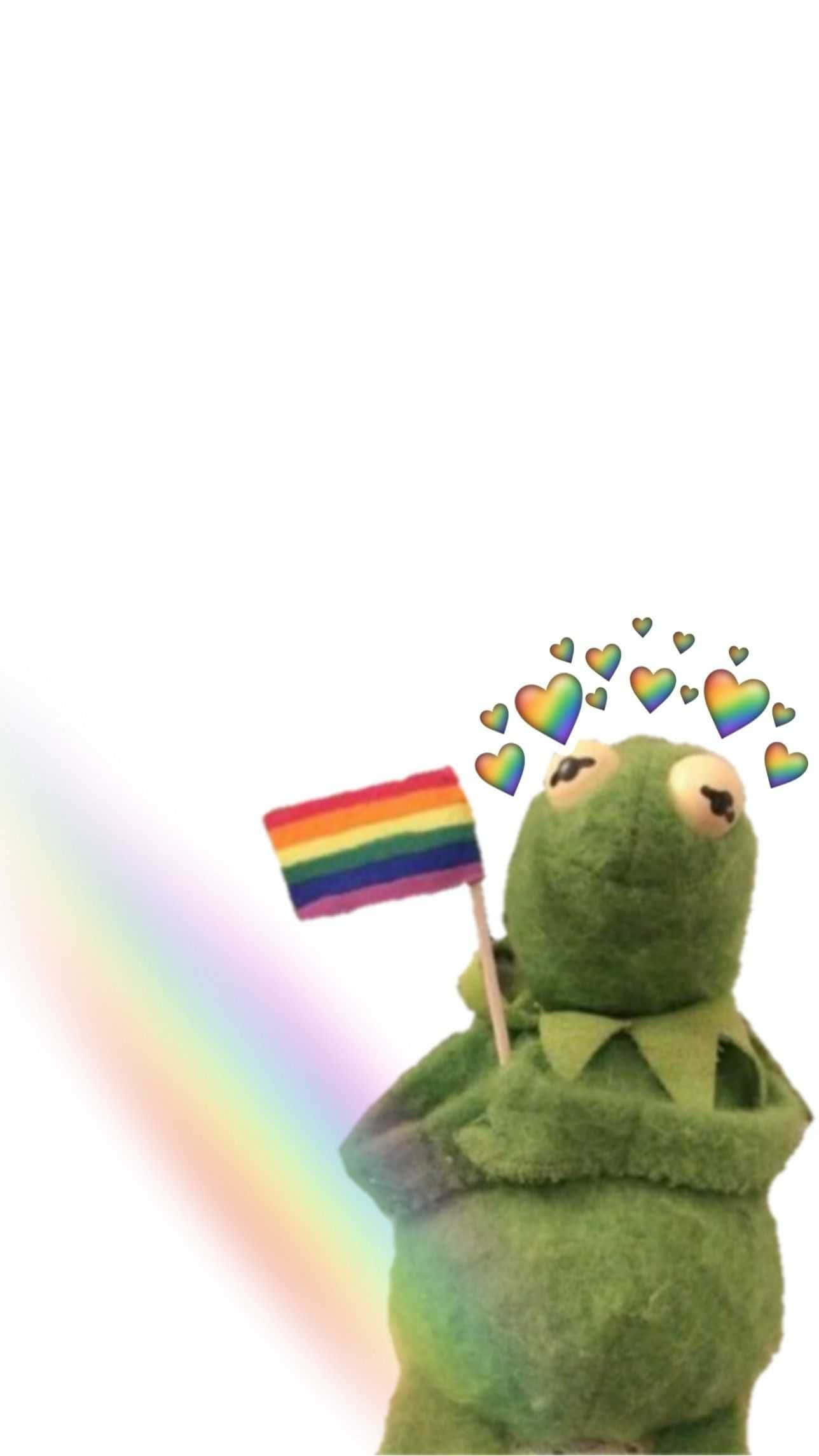 Aesthetic Kermit 桌布 壁紙 — 一隻綠色青蛙毛絨玩具手持彩虹旗，背後有漂浮的彩虹愛心和柔和彩虹光芒。