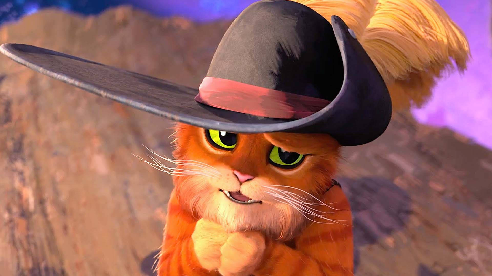 puss in boots 桌布 壁紙 — 一隻自信的橙色貓咪，綠色眼睛，戴著黑色牛仔帽，帽上有紅色帶子，背景是岩石山脈。