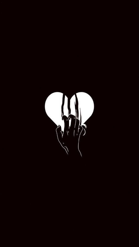 Broken Heart iPhone 桌布 壁紙 — 一隻蒼白的手在黑色背景上將心臟撕成兩半。