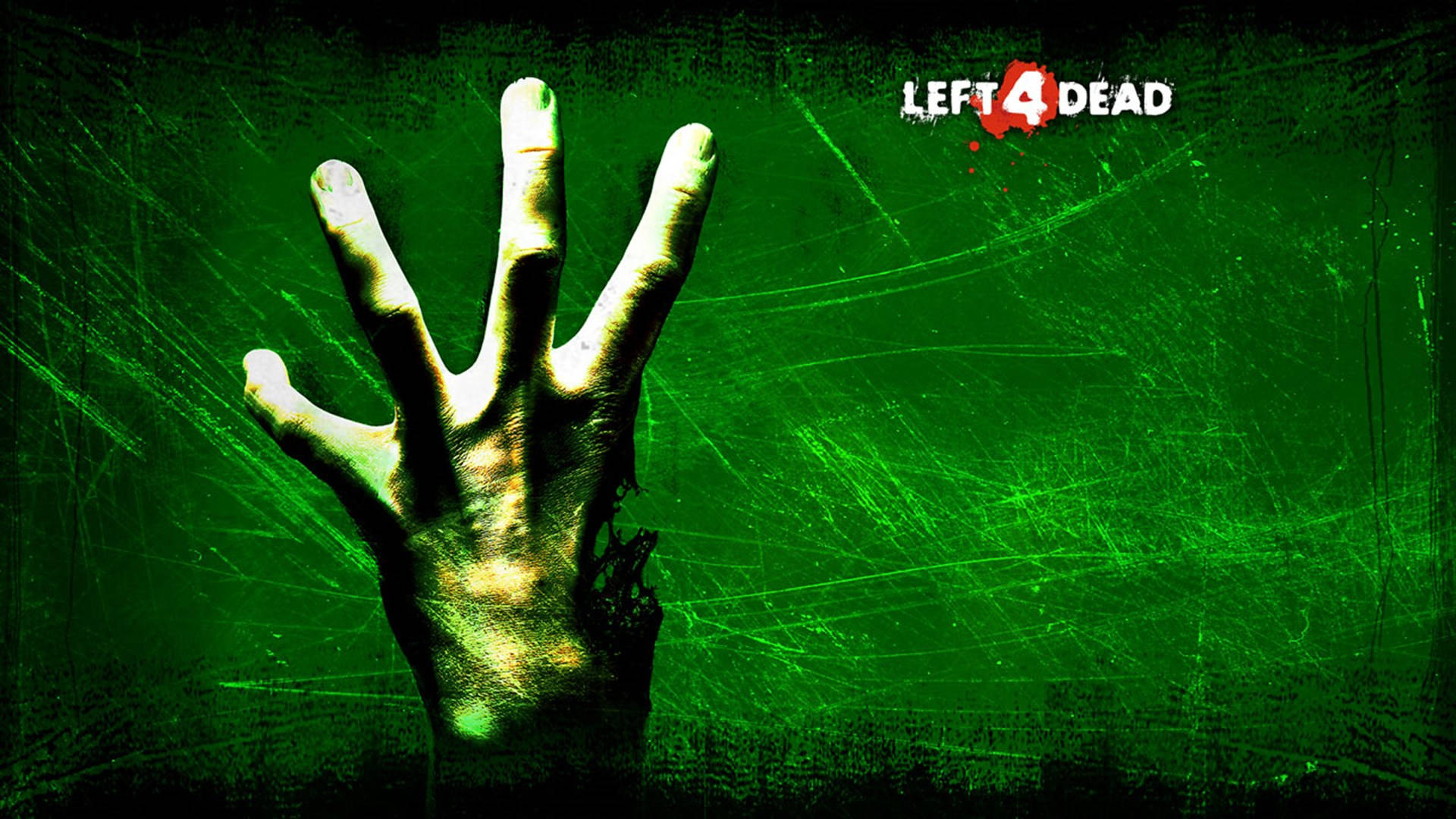 dead 桌布 壁紙 — 一隻蒼白的殭屍手抓住一塊玻璃板，背景是帶有 Left 4 Dead 標誌的刮痕綠色背景。