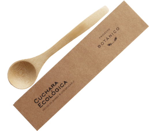 義大利麵 桌布 壁紙 — 一隻輕巧的木製環保湯匙放在其標有 'Cuchara Ecológica' 的棕色牛皮紙包裝旁邊，背景為純黑色。