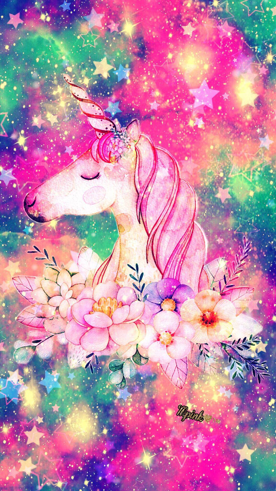 一幅水彩獨角獸在星空宇宙場景中被花朵環繞。 — 彩虹獨角獸 壁紙