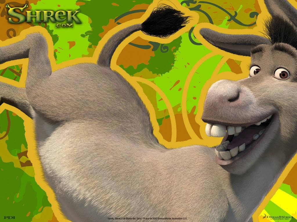 Shrek 2 桌布 壁紙 — 一隻開心的動畫驢子，咧嘴大笑，尾巴翹起，背景是充滿活力的綠色和黃色抽象圖案。
