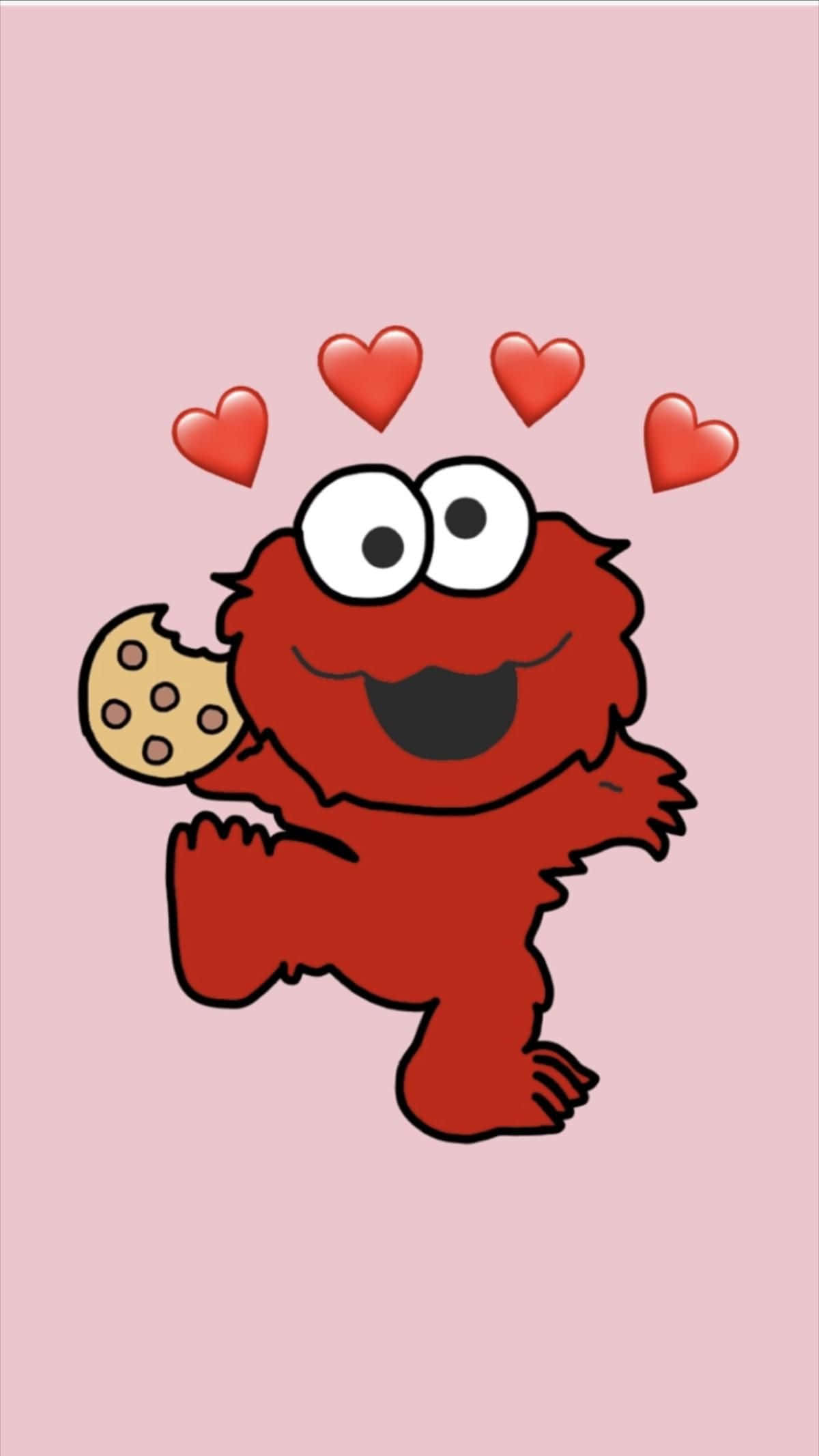 Elmo 桌布 壁紙 — 一隻開心的紅色卡通怪獸在柔和的粉紅色背景前，開心地拿著一塊巧克力餅乾，頭頂有心形漂浮。