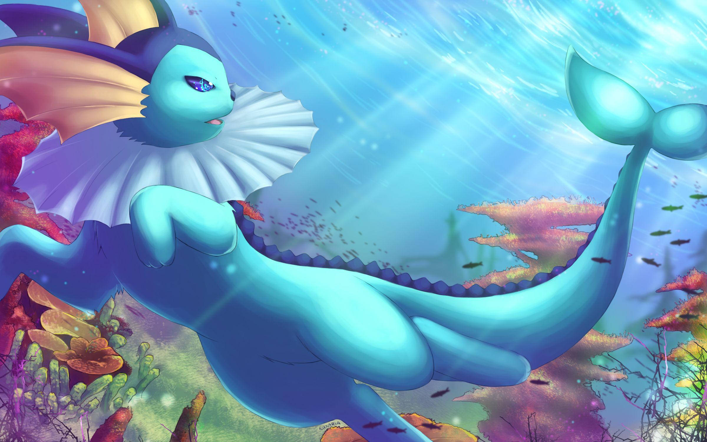 寶可夢 桌布 壁紙 — 一隻雄偉的藍色美人魚般的生物，擁有流暢的鰭，在陽光普照的海洋中優雅地滑過充滿活力的珊瑚礁。