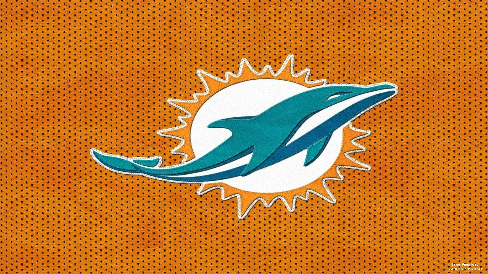 dolphins 桌布 壁紙 — 一隻青綠色海豚標誌在橙色穿孔背景上的白色太陽光芒中跳躍。
