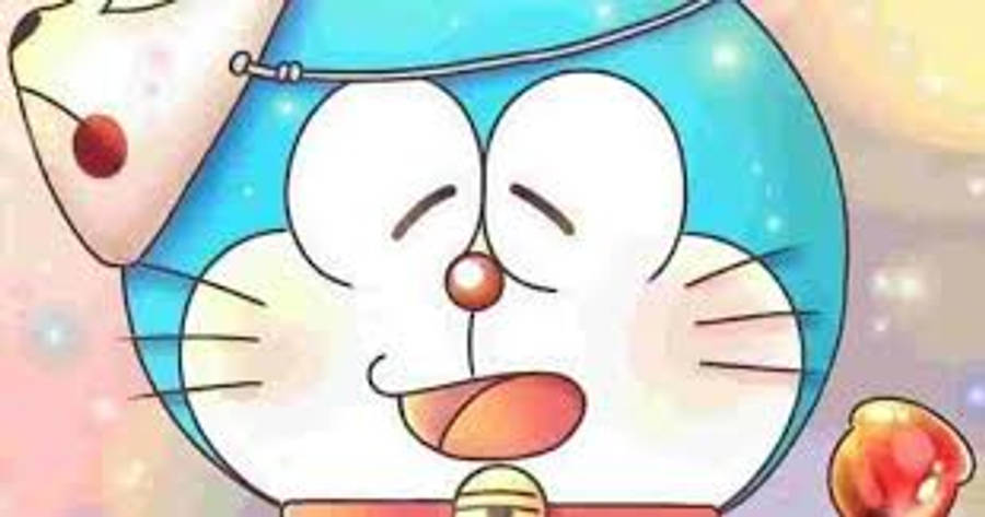 doraemon 4K 桌布 壁紙 — 一隻頭圓眼大的開心藍色機械貓，在閃爍的粉彩背景前燦爛微笑。