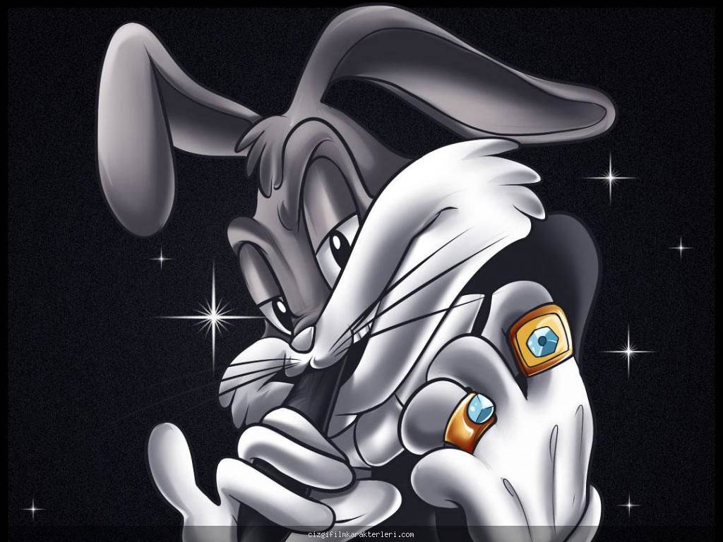 bugs 桌布 壁紙 — 一隻風格化的卡通兔，長耳朵和鑲有寶石的戒指，在星光閃爍的黑色背景前擺姿勢。