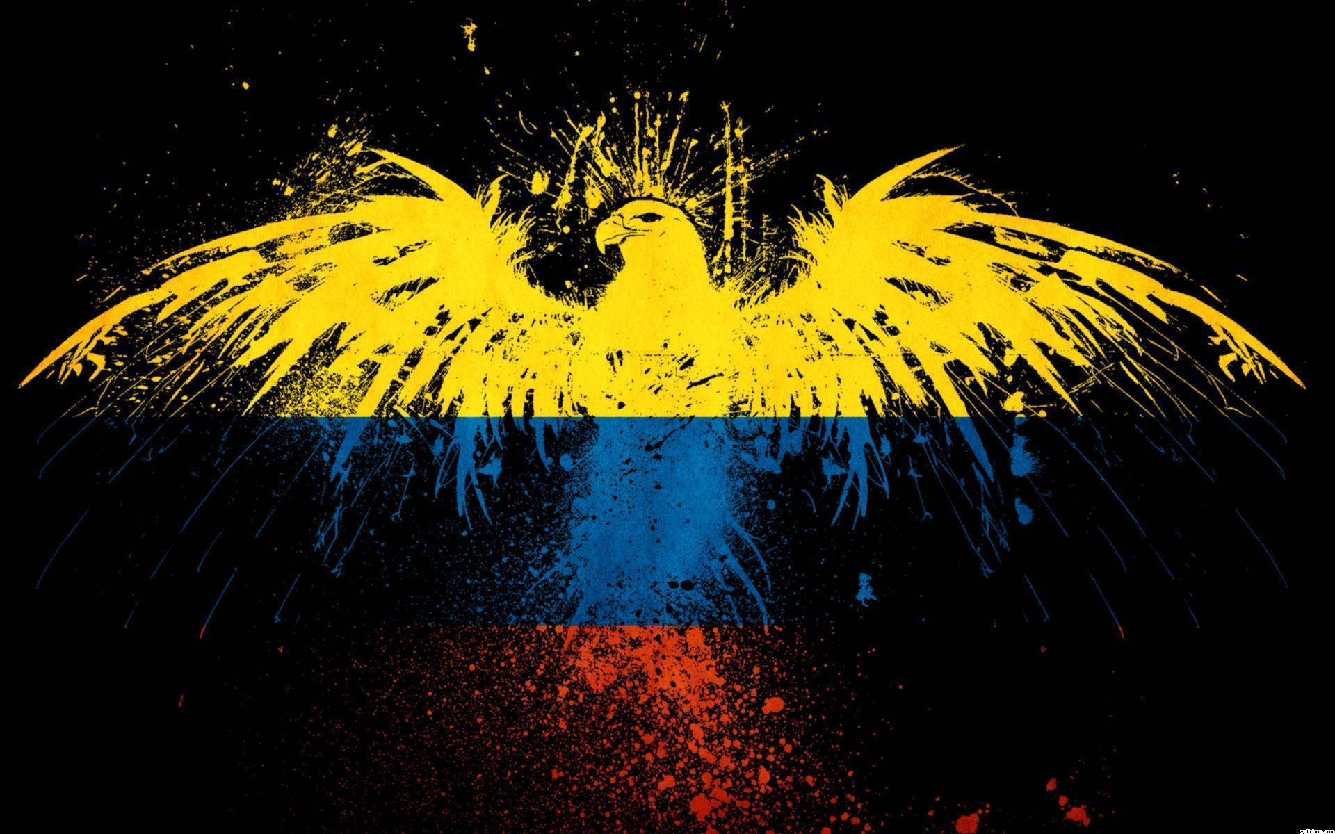Colombia 桌布 壁紙 — 一隻風格化的黃色鷹展開翅膀，在黑色背景上形成哥倫比亞國旗，帶有飛濺效果。