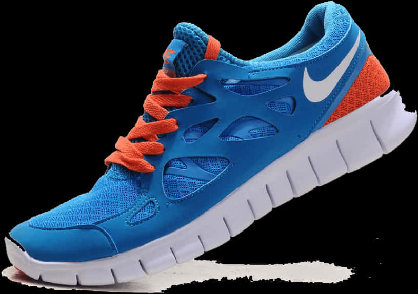 鞋子 桌布 壁紙 — 一雙充滿活力的藍色和橙色Nike跑鞋，白色鞋底，在黑色背景上清晰展示細節。