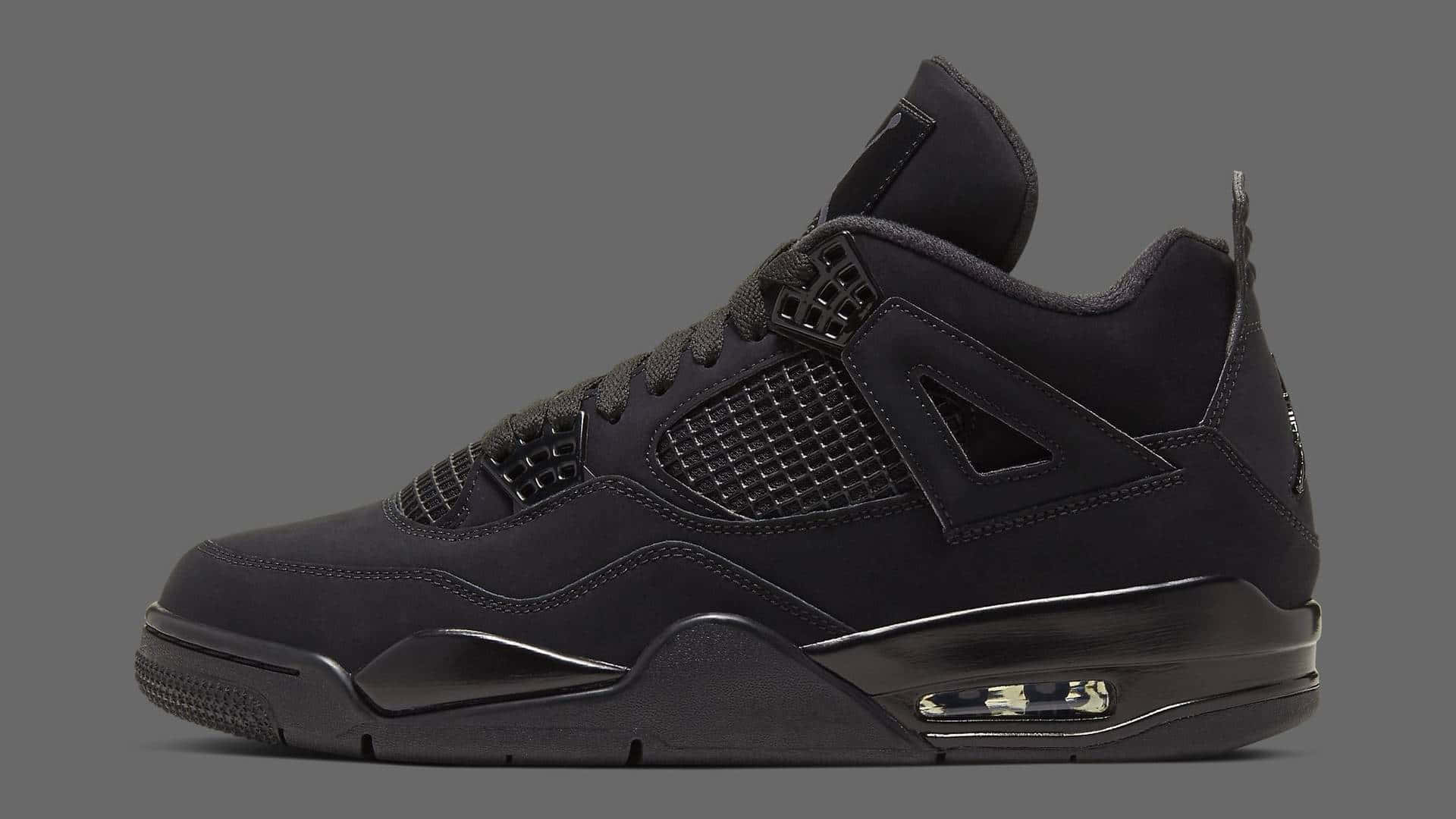 黑色Jordan 4運動鞋，配備可見式Air氣墊和紋理網眼面板。 — Air Jordan 1 壁紙