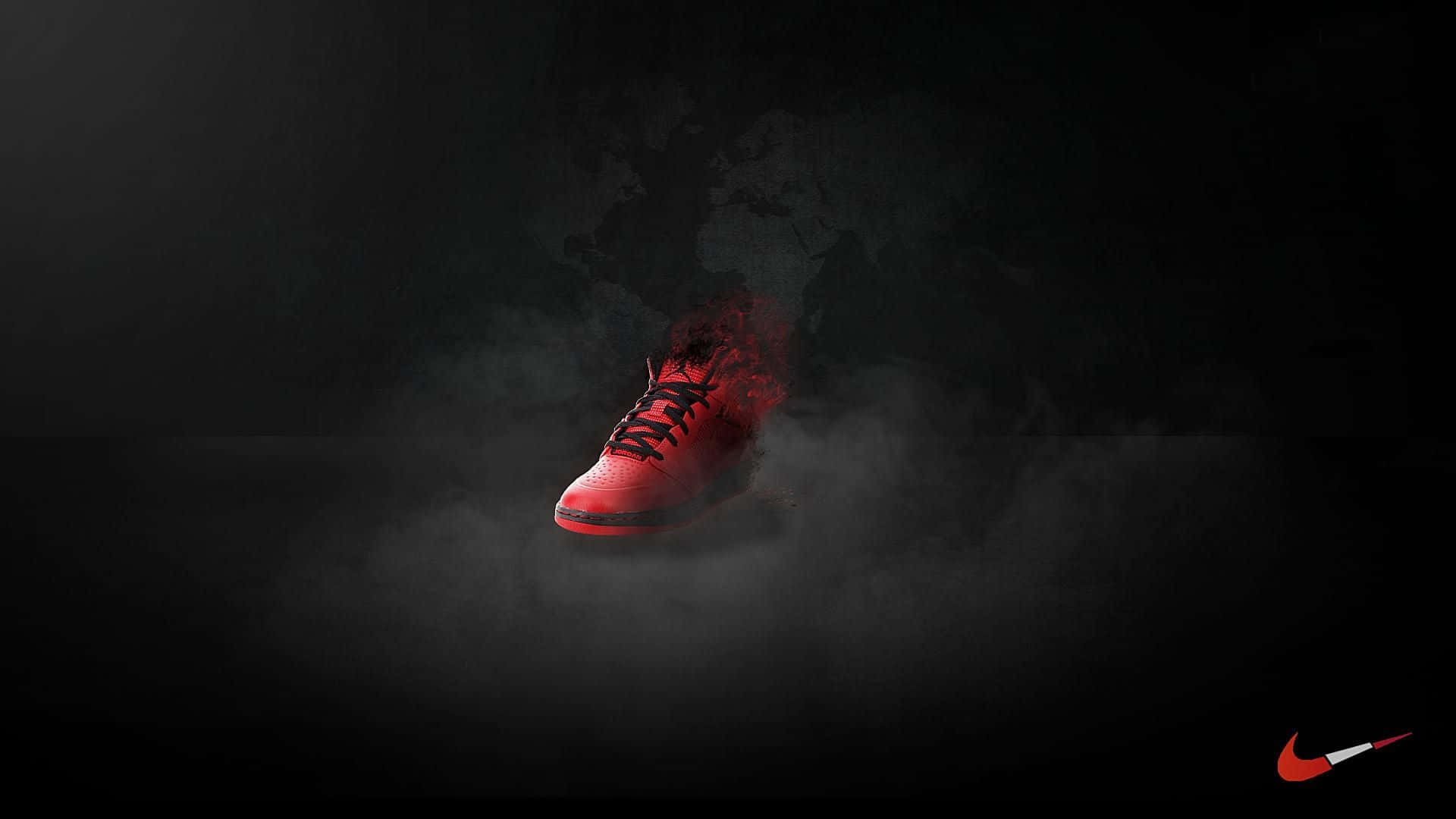 Red Nike 桌布 壁紙 — 一雙發光的紅色運動鞋從黑煙中顯現，背景是黑色並帶有模糊的世界地圖輪廓。