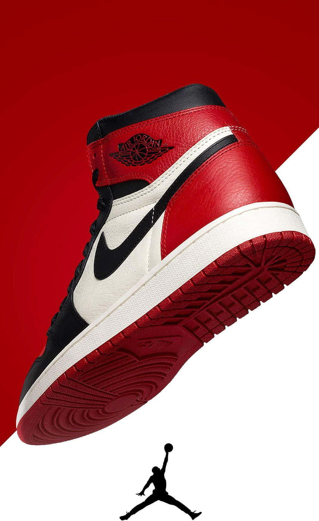桌布 壁紙 — 一雙紅、黑、白色的Jordan 1運動鞋以對角線漂浮在搶眼的紅白背景上，下方有Jumpman標誌。