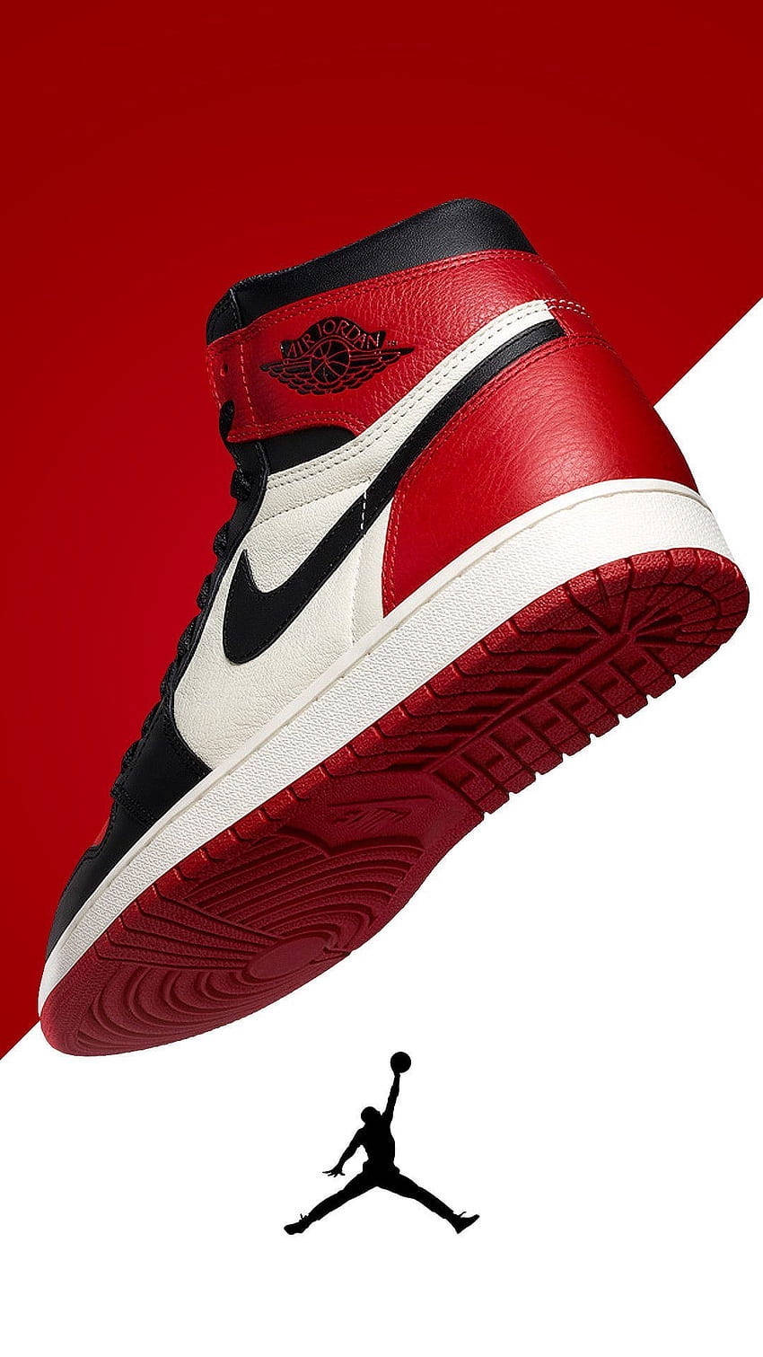 Air Jordan 桌布 壁紙 — 一雙紅黑白色Jordan 1運動鞋以對角線漂浮在鮮明的紅白分割背景上，下方有Jumpman標誌。