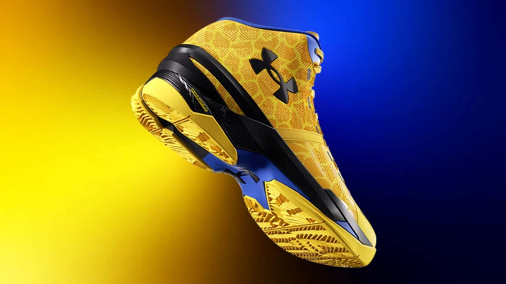 Under Armour 桌布 壁紙 — 一雙鮮豔的黃藍色 Under Armour 籃球鞋漂浮在從黃色到藍色的漸變背景上。