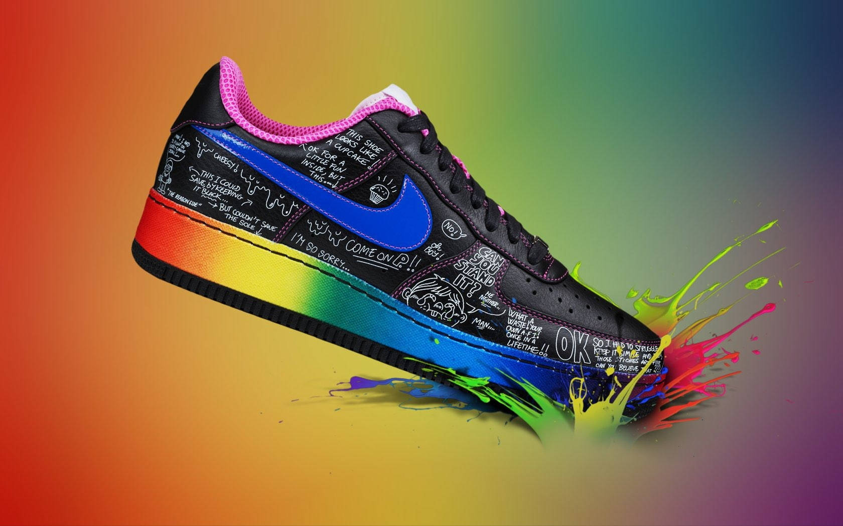Nike iPhone 桌布 壁紙 — 一雙黑色運動鞋帶有彩虹油漆飛濺和手寫訊息，漂浮在漸變背景上。