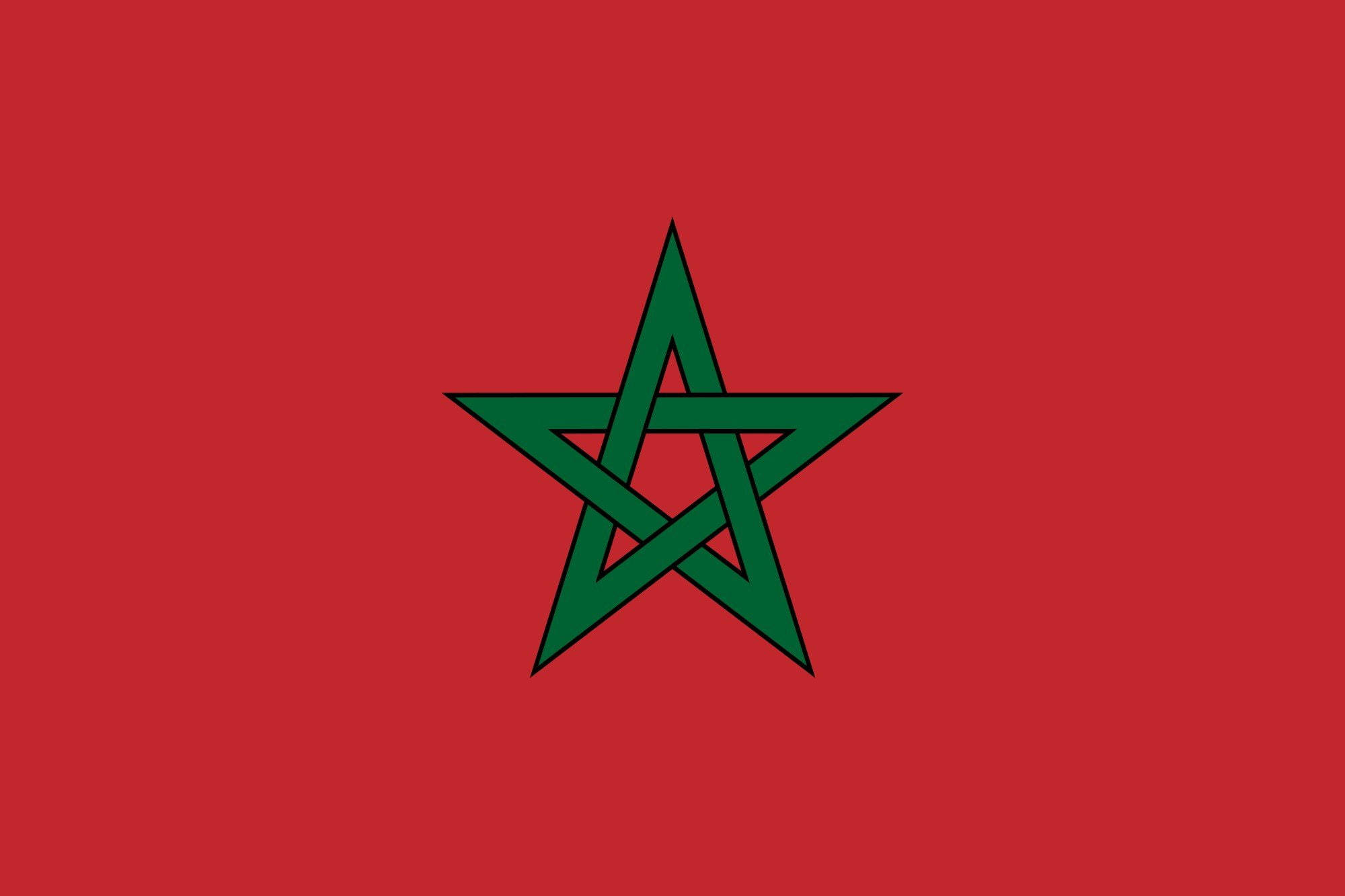 Morocco 桌布 壁紙 — 一面大膽的紅色旗幟，中央有一個帶有銳利黑色輪廓的綠色五角星符號。