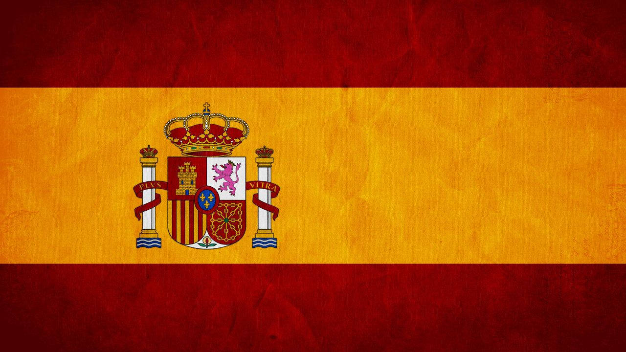 Spain Flag 桌布 壁紙 — 一面帶有紋理的復古西班牙國旗，紅黃條紋，黃色條帶中央有詳細的盾徽。