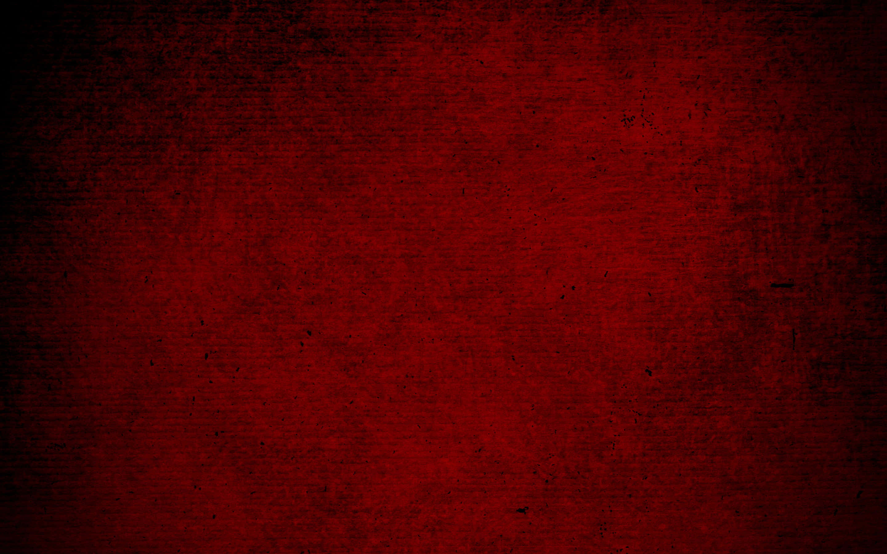Dark Red Aesthetic 桌布 壁紙 — 一面帶有紋理的深紅色牆壁，邊緣變暗，帶有細微斑點，營造出陰鬱的復古背景。