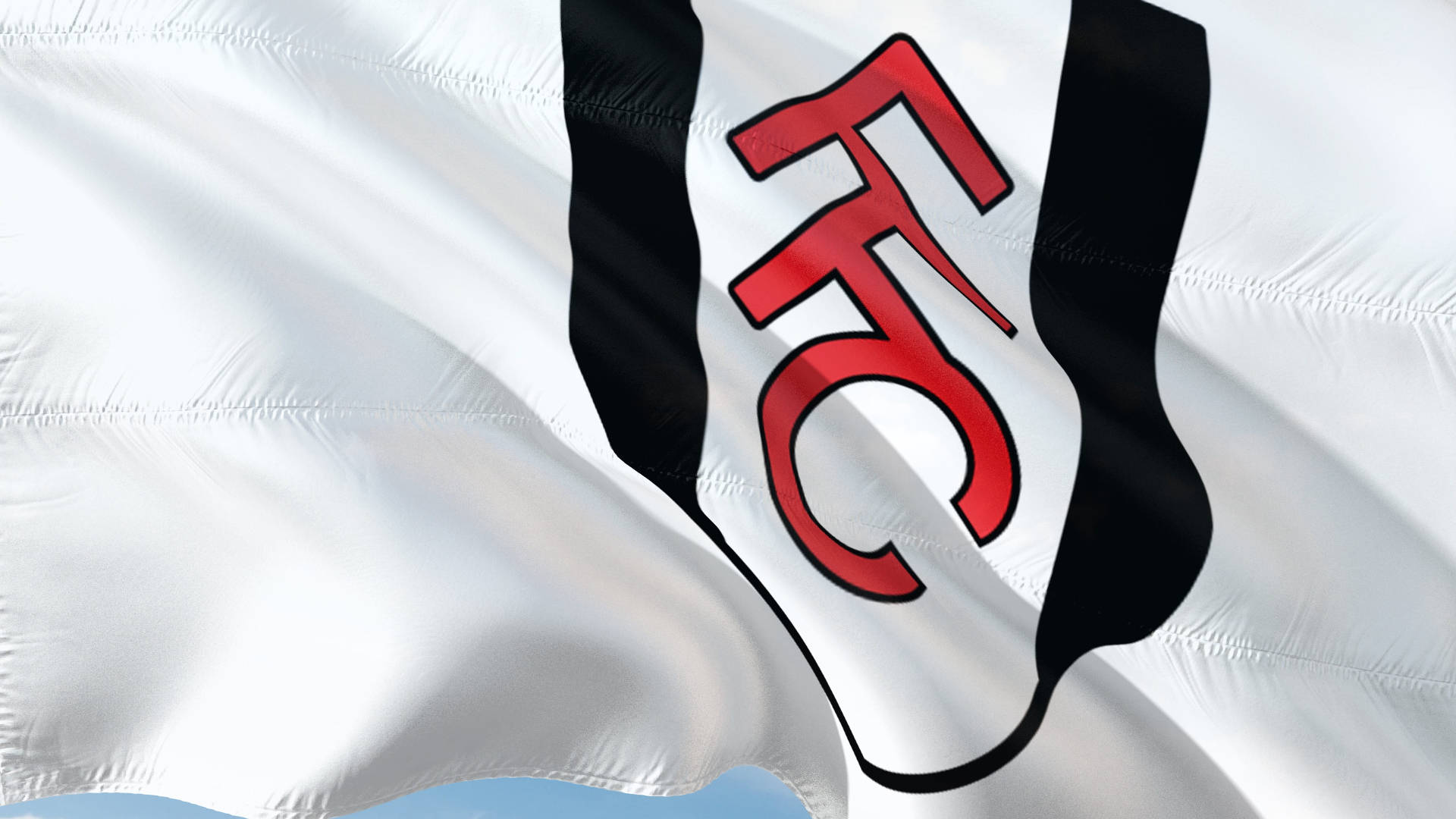 Flag 桌布 壁紙 — 一面帶有黑色條紋和紅色「FFC」標誌的白色旗幟在晴朗藍天下隨風飄揚的特寫。
