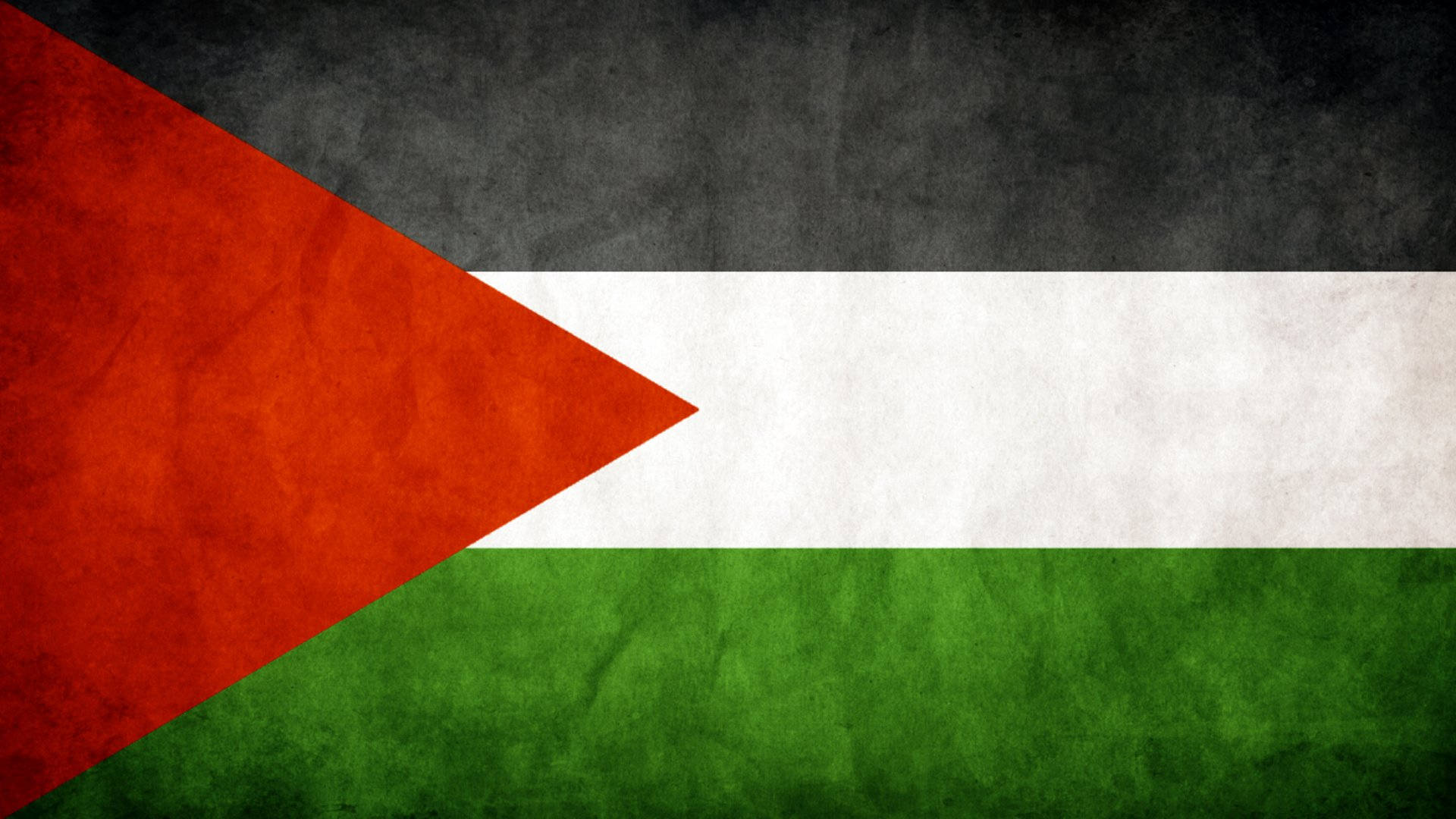 Palestine 桌布 壁紙 — 一面有紋理的巴勒斯坦國旗，帶有黑色、白色和綠色條紋以及一個紅色三角形，背景為風化的布料。
