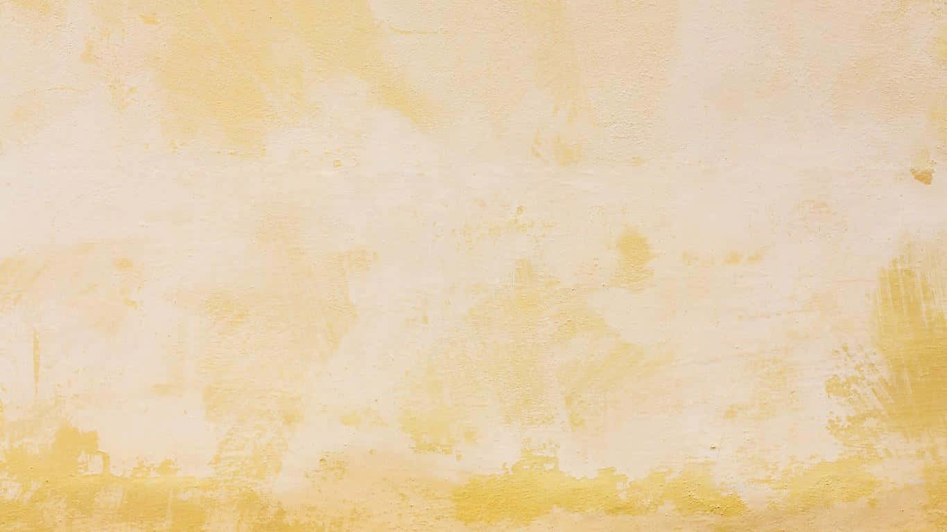 Aesthetic Yellow 桌布 壁紙 — 一面有紋理的牆壁，塗上柔和的黃色和奶油色，帶有可見的筆觸和輕微磨損。