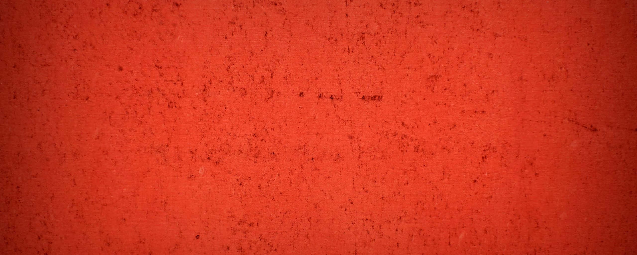 texture 桌布 壁紙 — 一面有紋理的鮮紅色牆壁，表面帶有細微斑點和輕微刮痕。