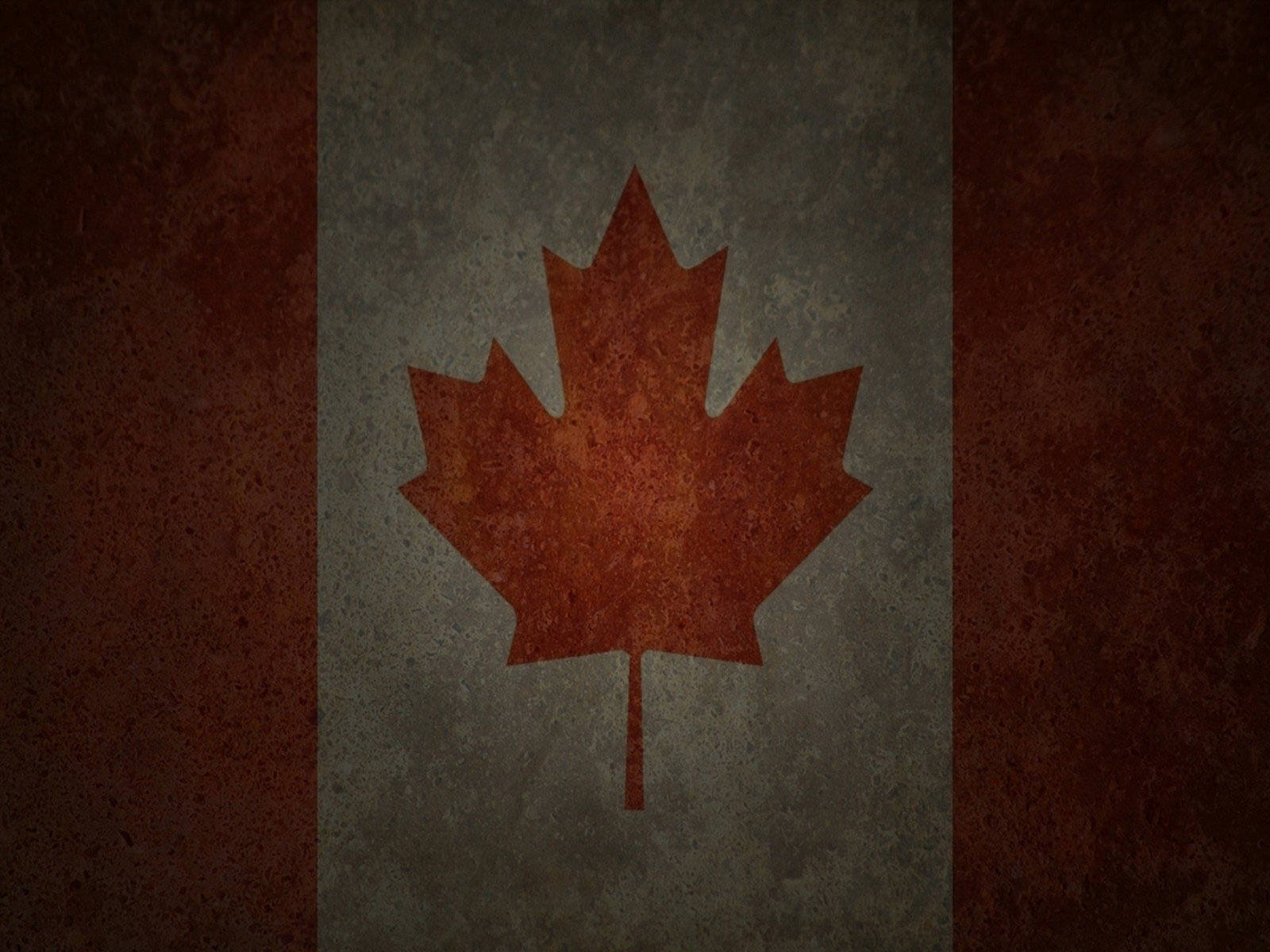Canada Flag 桌布 壁紙 — 一面經風化的加拿大國旗，灰色區域中央有一片紅色楓葉，兩側有紅色條紋。