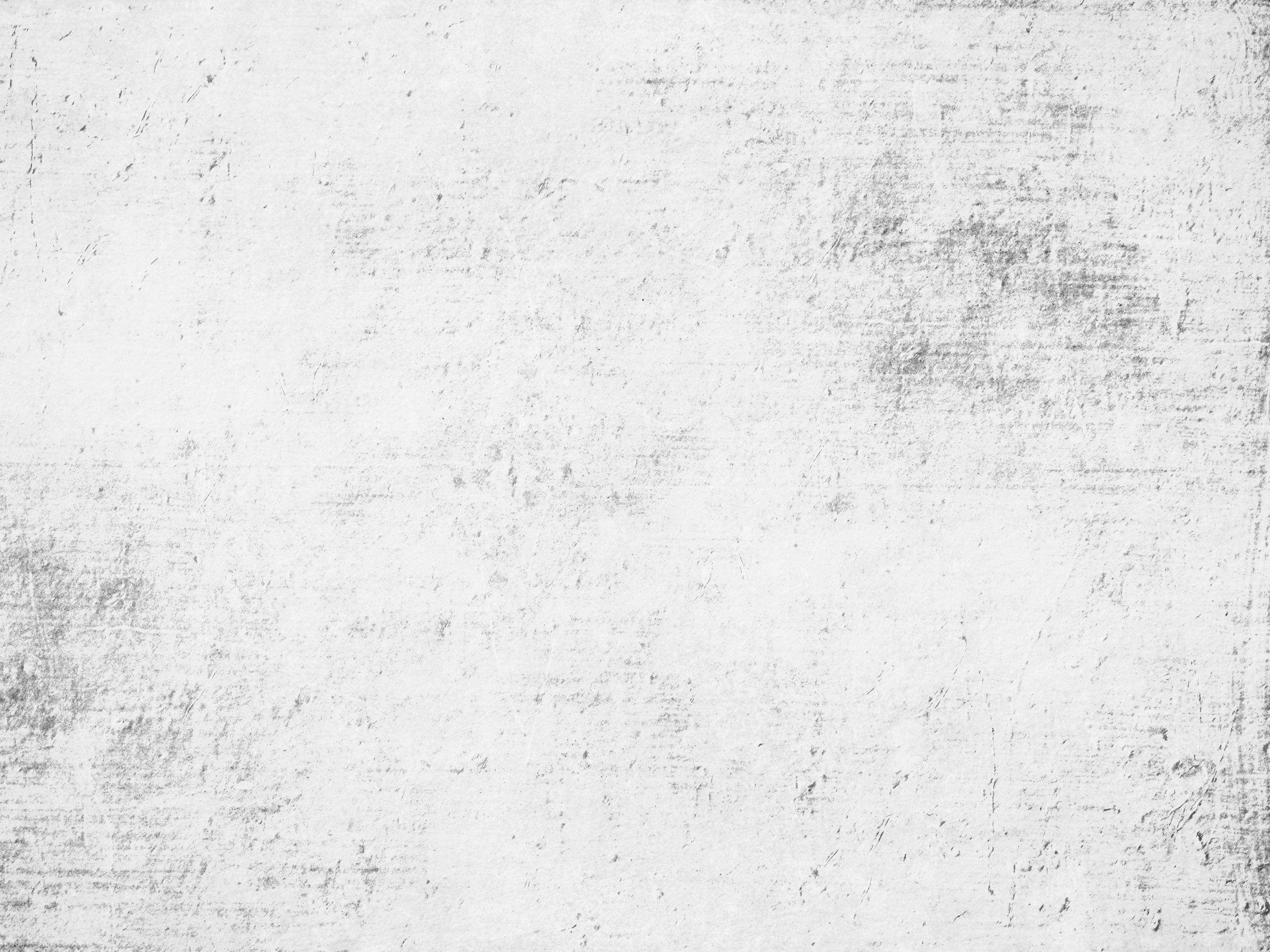 White Texture 桌布 壁紙 — 一面經風化的白色牆壁，帶有細微的灰色條紋和刮痕，營造出質樸的紋理背景。