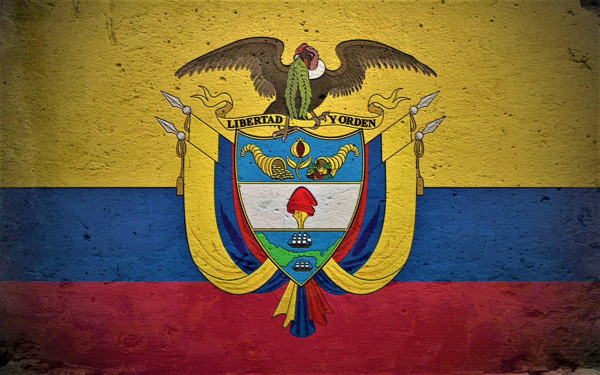 Colombia Flag 桌布 壁紙 — 一面經風化紋理的厄瓜多國旗，國徽上有神鷹和盾牌，位於黃、藍、紅條紋上。