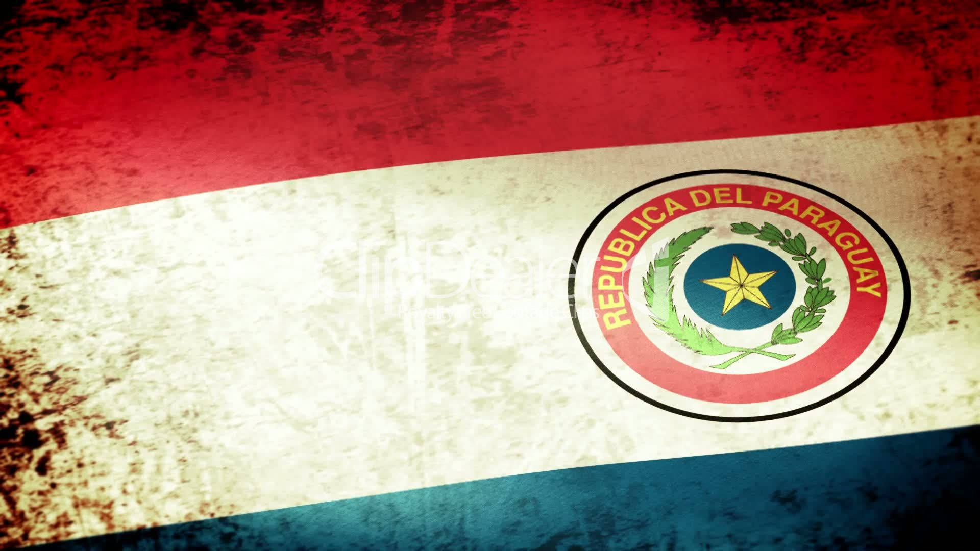 Paraguay 桌布 壁紙 — 一面風化的巴拉圭國旗，有紅、白、藍條紋，中央徽章顯示一顆被月桂樹枝包圍的黃色星星。