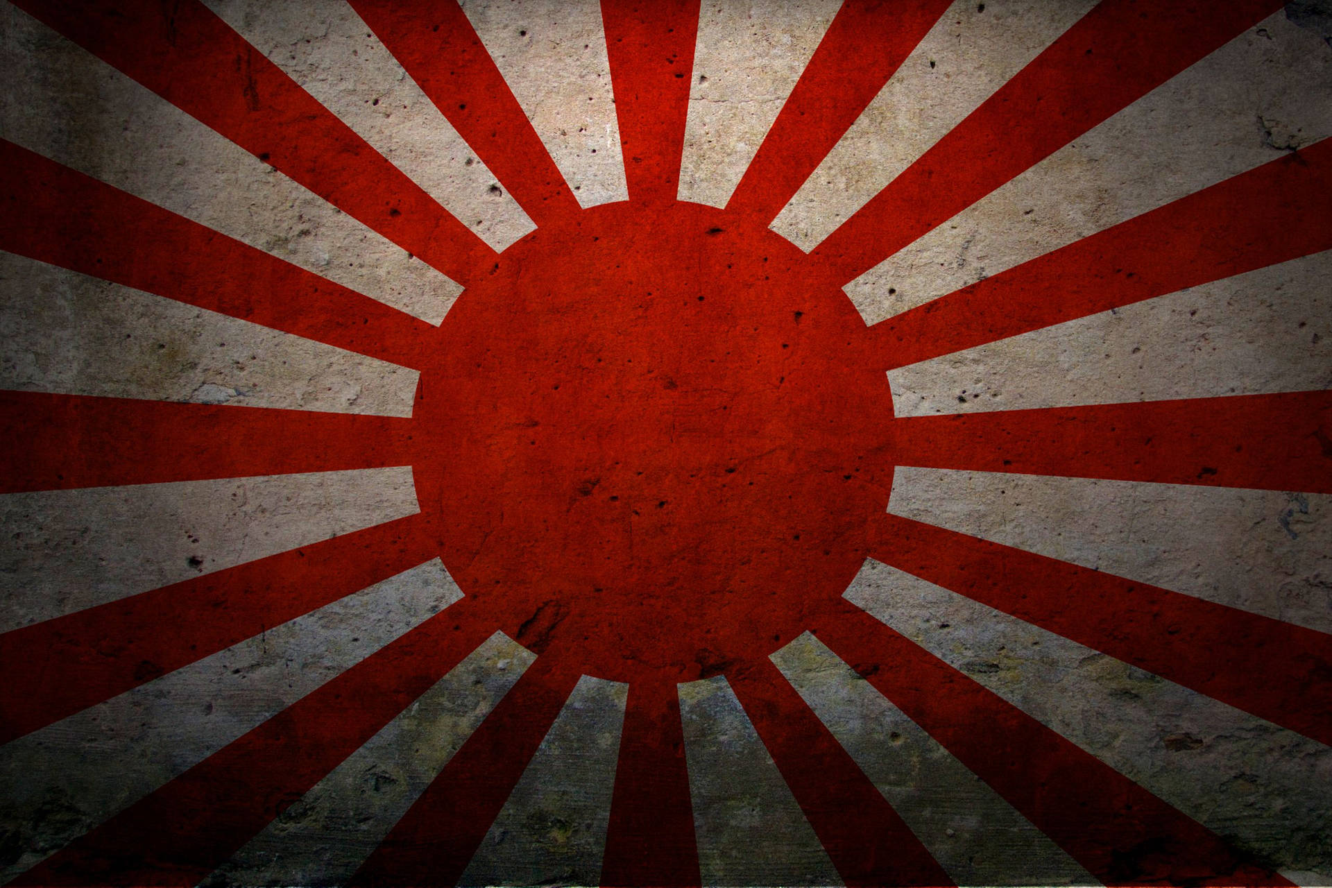 風化的日本旭日旗，紅色光線在灰色紋理背景上。