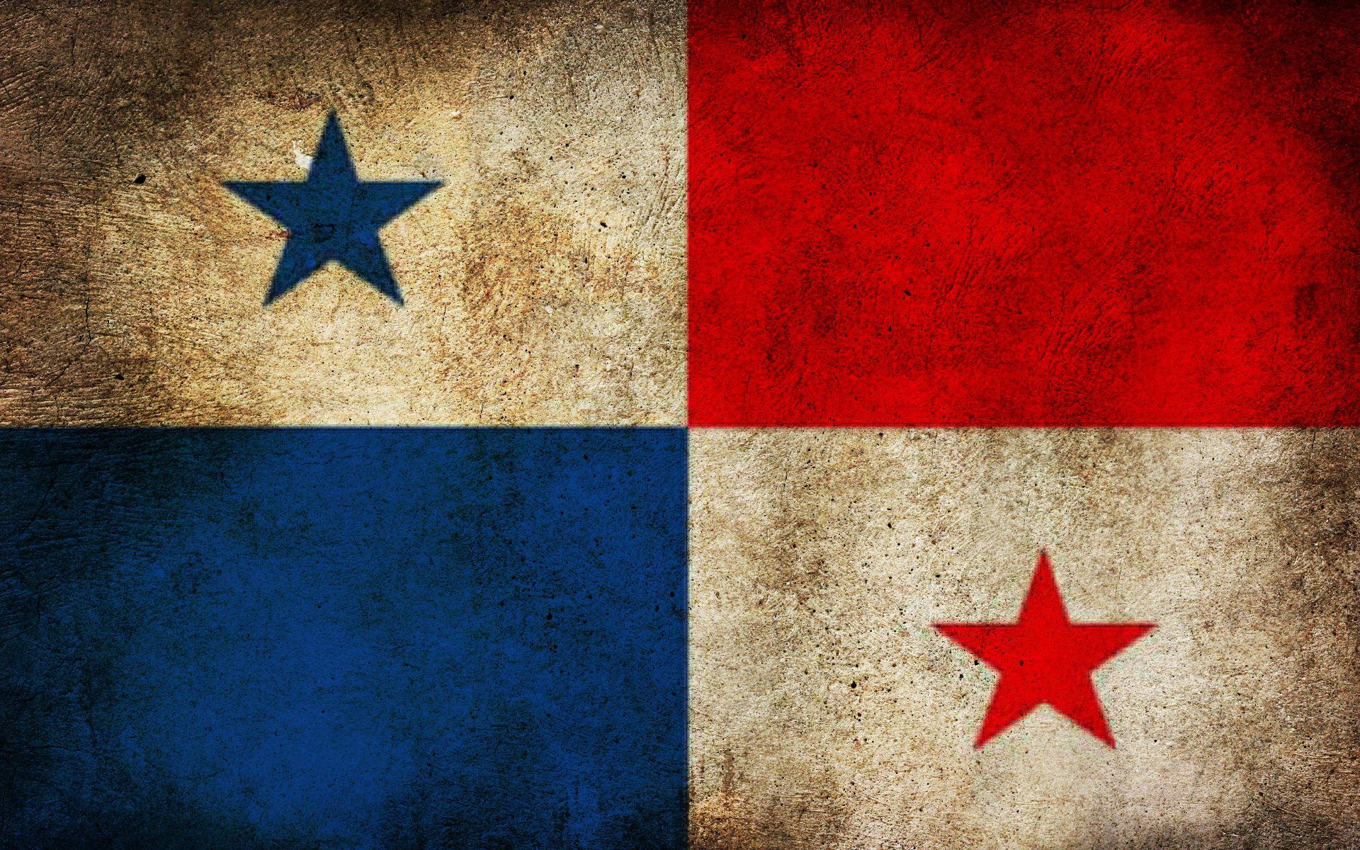 Panama 桌布 壁紙 — 一面風化質感的巴拿馬國旗，帶有紅色、藍色和米色象限及星星，顯示出老化及磨損的跡象。
