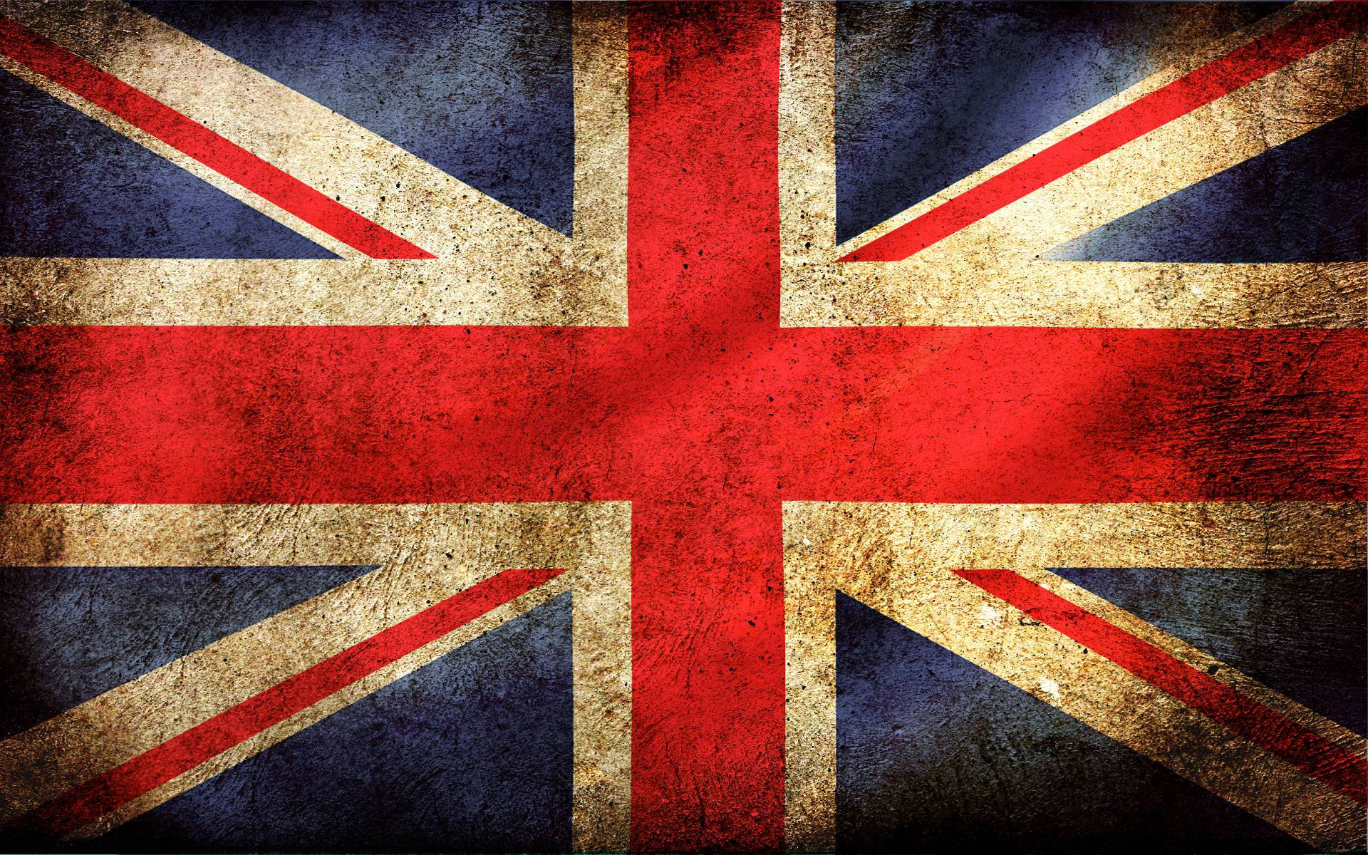 United Kingdom Flag 桌布 壁紙 — 一面飽經風霜的英國國旗，帶有裂紋的紅、白、藍條紋，顯示出歲月和磨損的痕跡。