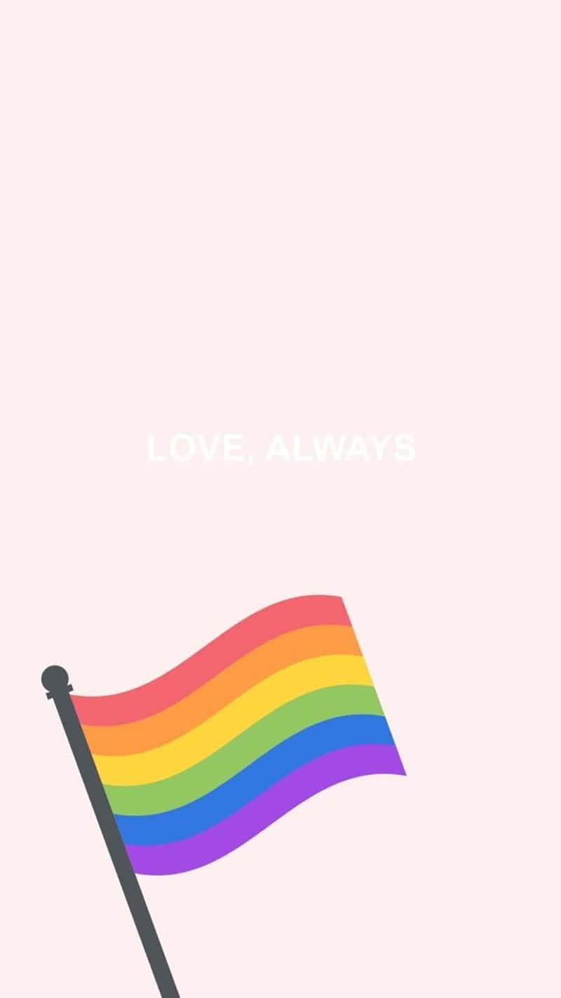 Lgbtq 桌布 壁紙 — 一面鮮豔的彩虹旗在柔和的粉紅色背景上輕輕飄揚，上面有白色的 love always 文字。